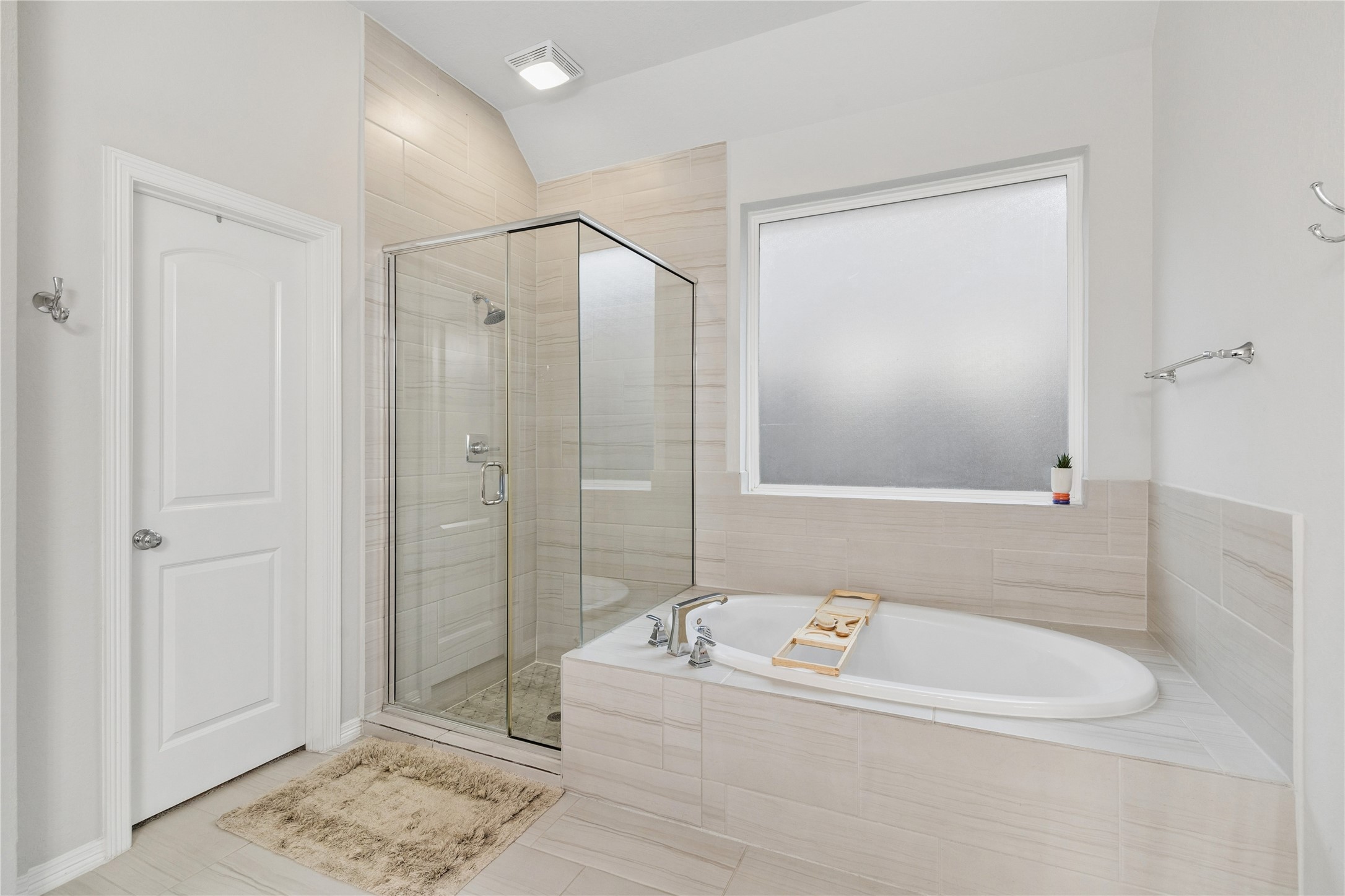 chrome accents, earth tones, large soaking tub.