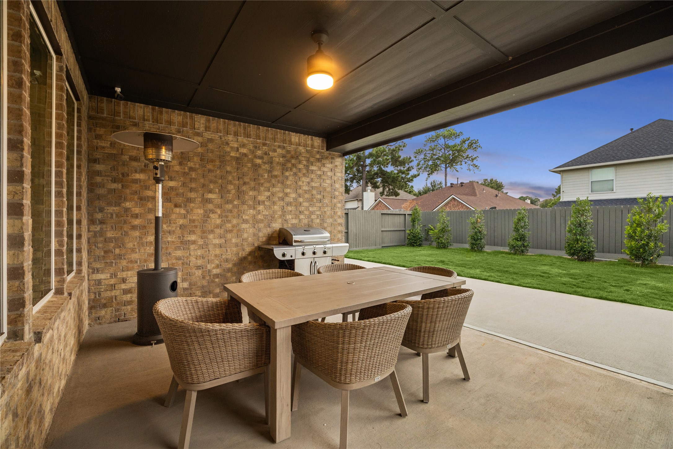 expanded back patio & Eagleston Holly trees added in.