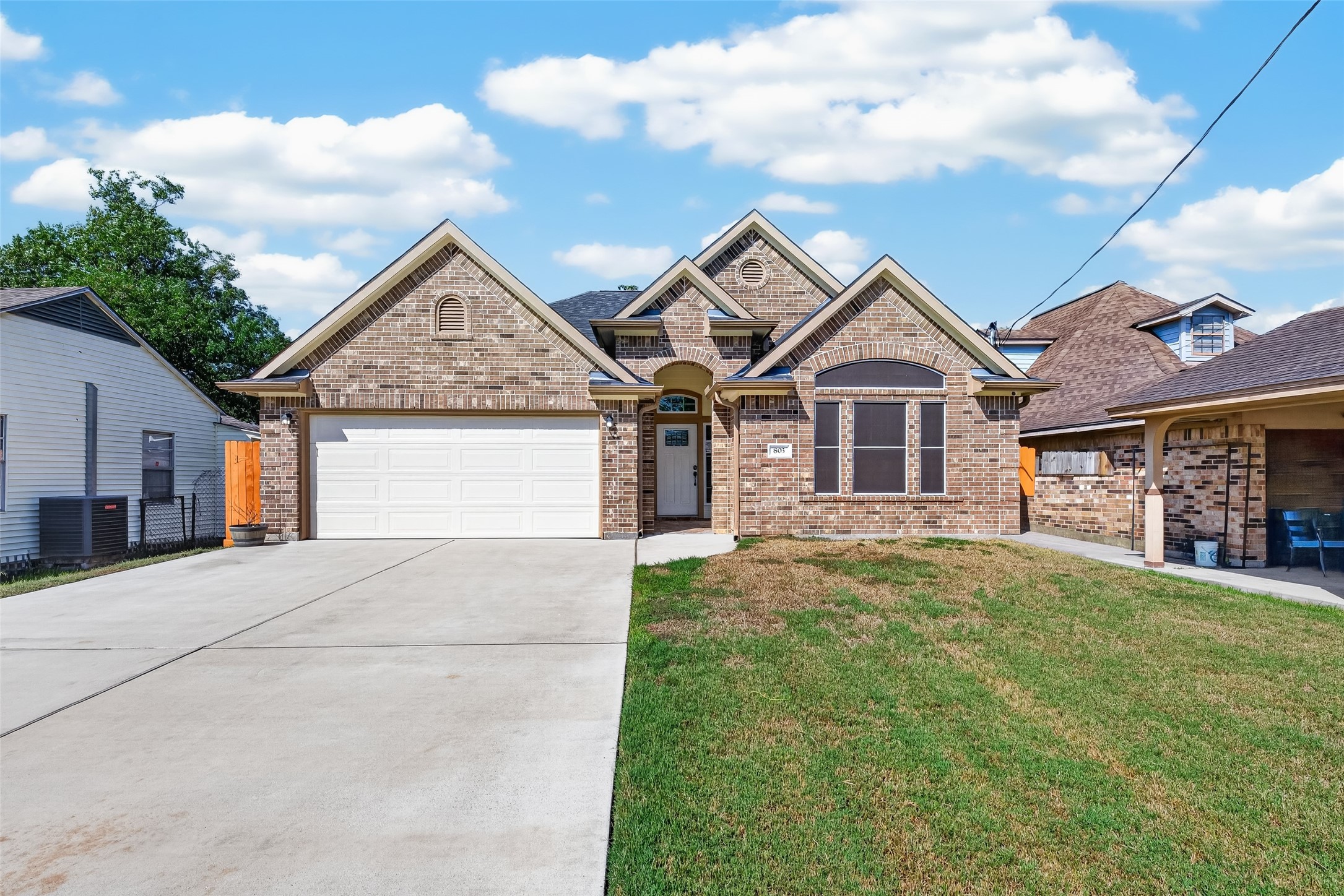 Charming brick home with a welcoming facade, featuring a spacious double garage. Charming brick home with a welcoming facade, featuring a spacious double garage.