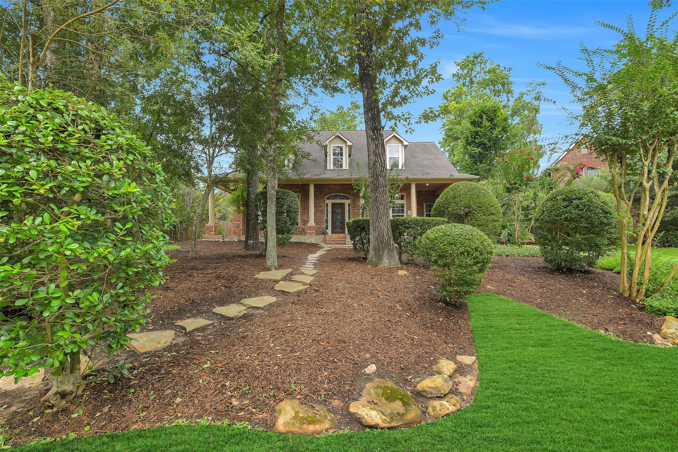 Discover your serene retreat at 7 Larkspur Trail, perfectly situated in the heart of The Woodlands, offering a harmonious blend of nature and comfort.
