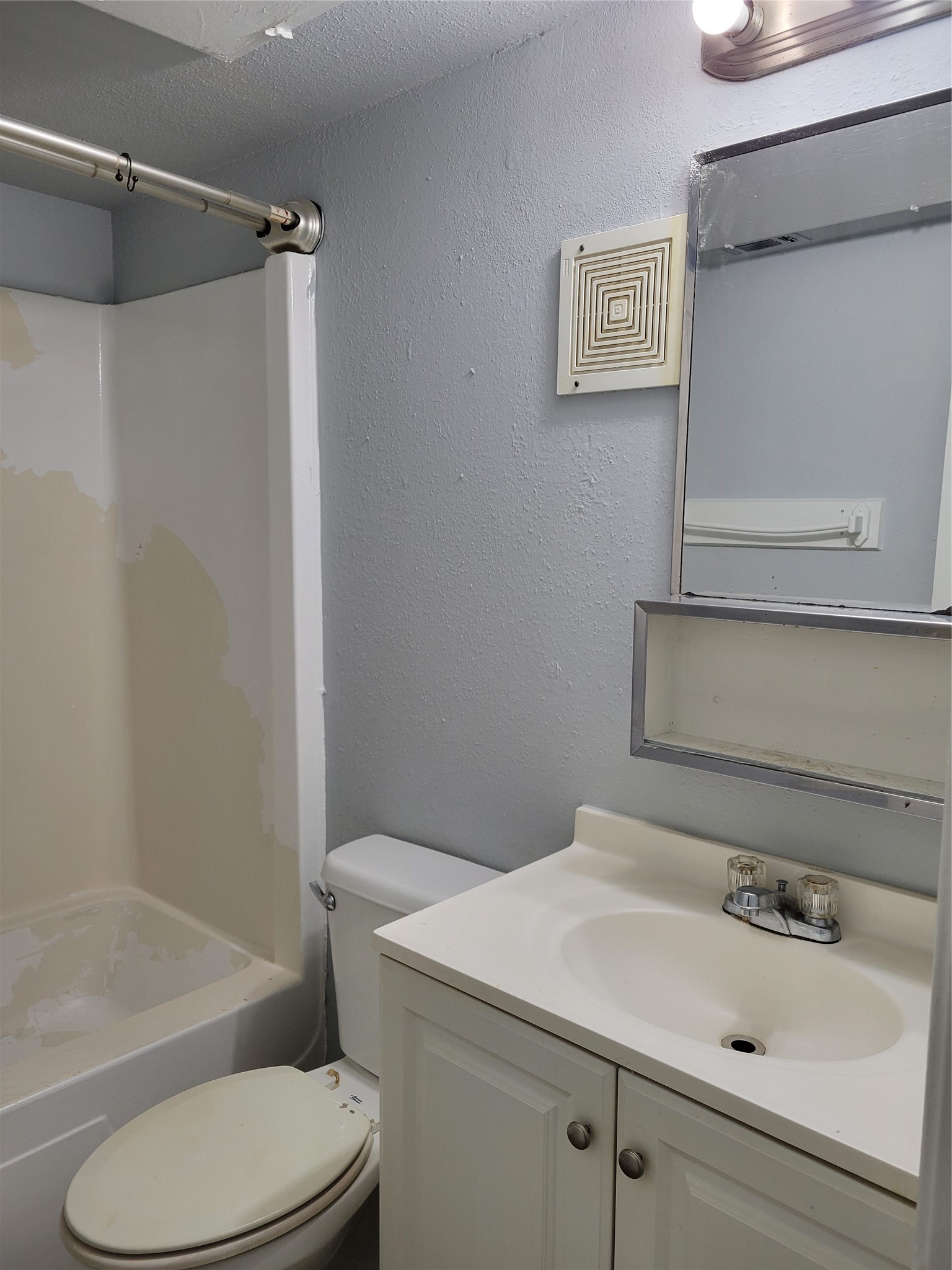 Bathroom with tub and shower combo