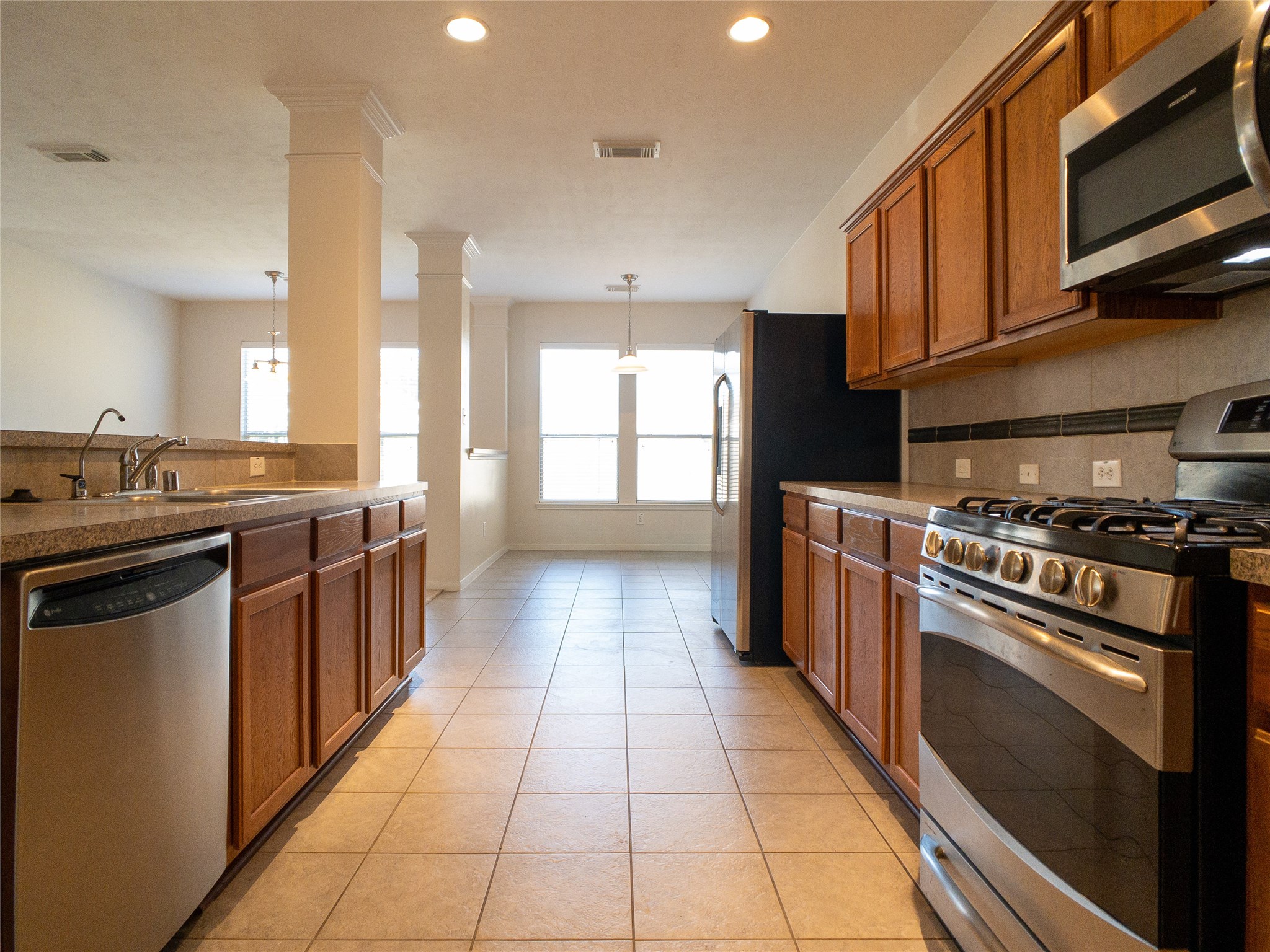 reverse view of kitchen: nice Formica countertops, tile backsplash