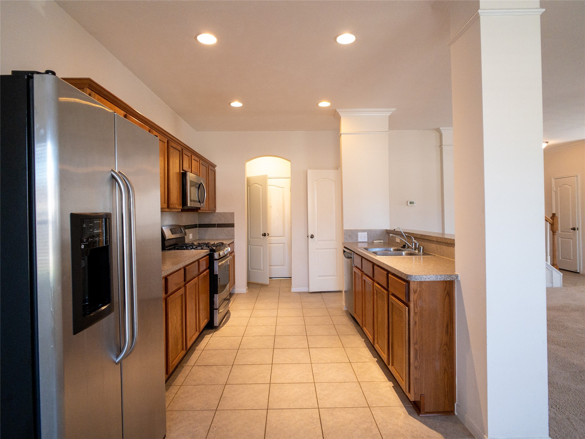 kitchen with stainless-steel appliances, including side-by-side refrigerator with icemaker