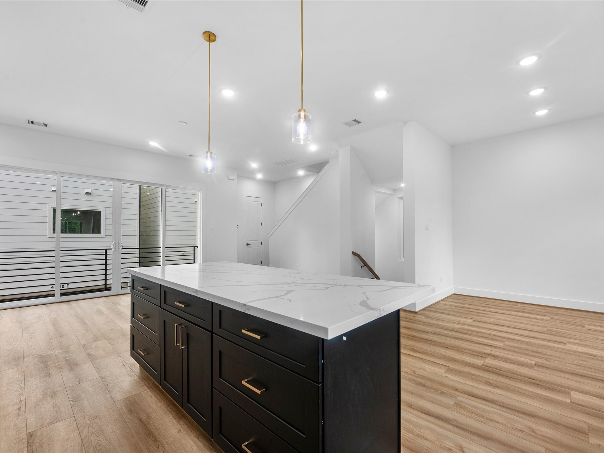 Bright, expansive open-concept space with a seamless flow between the kitchen, dining, and living areas. The generous layout creates an airy, connected feel with plenty of room for entertaining and everyday living.