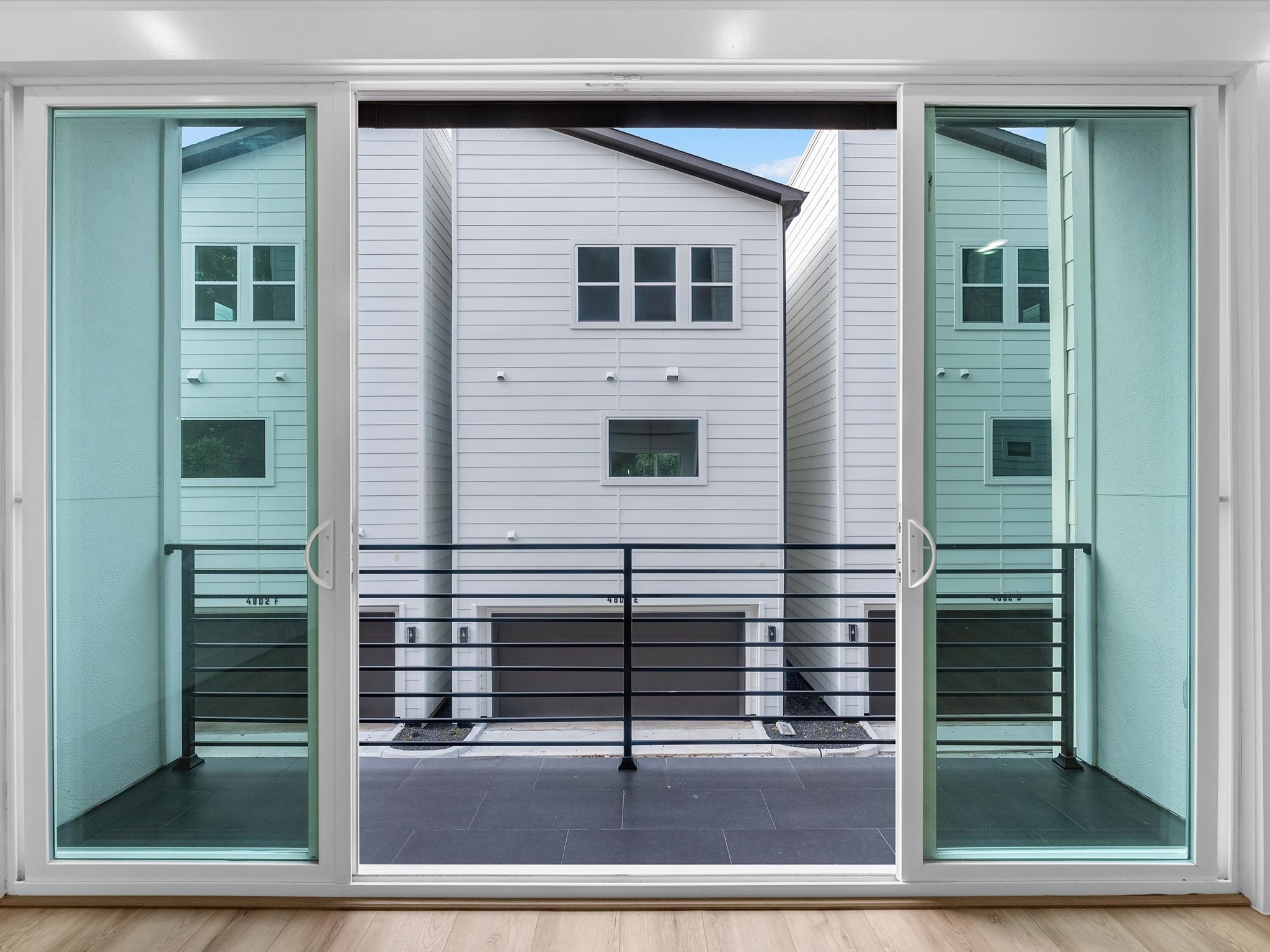 Large sliding glass doors create a seamless indoor-outdoor feel, opening directly to the private balcony. Perfect for bringing in natural light and extending the living space outdoors.