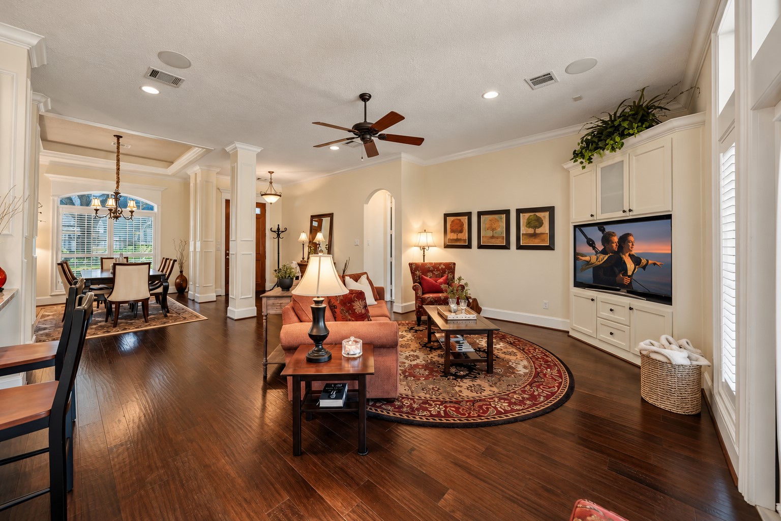 The custom corner Entertainment Center is as functional as it is attractive, featuring generous, closed storage designed to discreetly house gaming consoles, toys, board games, and everyday essentials. Thoughtfully integrated into the space, it keeps the Family Room organized, uncluttered, and ready for both entertaining and daily living.