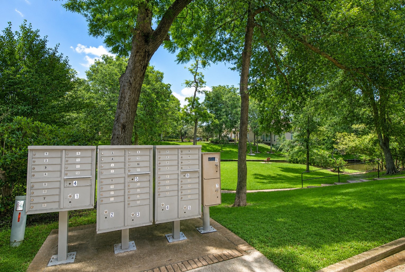 Conveniently located within the community, the neighborhood mailbox center is surrounded by lush landscaping and majestic oak trees, offering a peaceful setting for everyday errands. Just steps away, scenic walking paths and tranquil canal views create a welcoming atmosphere that reflects the beauty and charm of Weston Lakes.