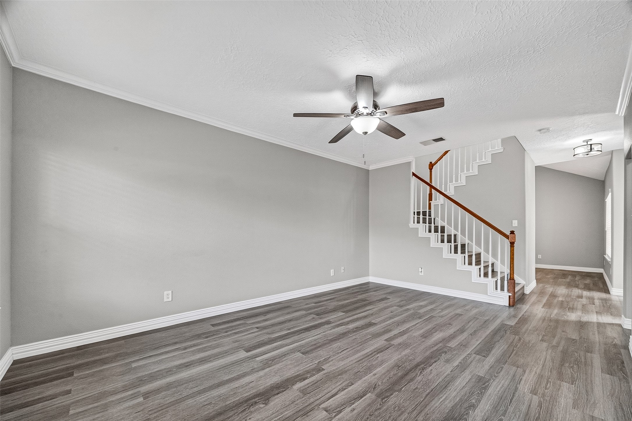 Open living space flows easily to the stairs and dining area