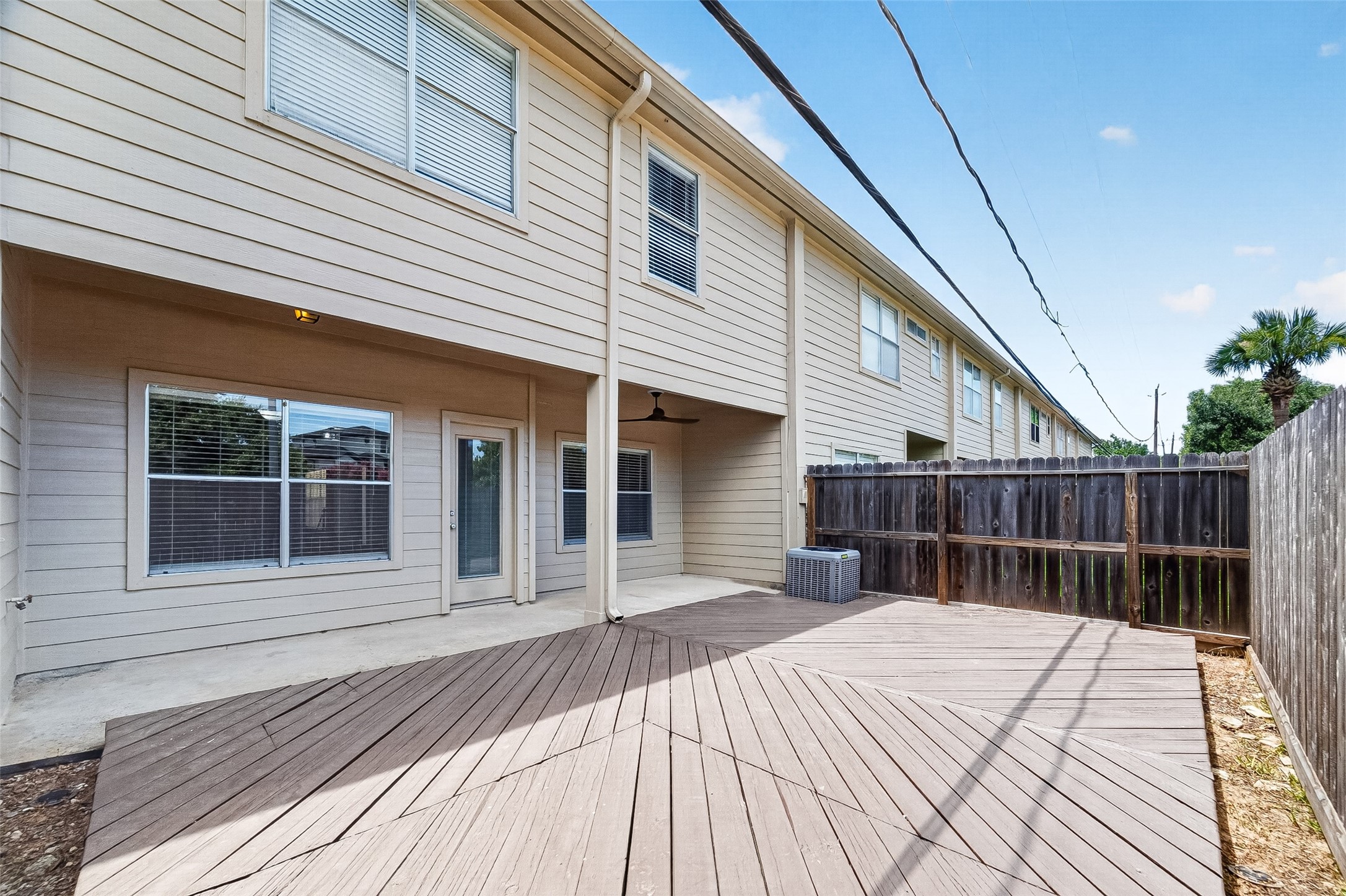 Private fenced backyard with deck, great for relaxing