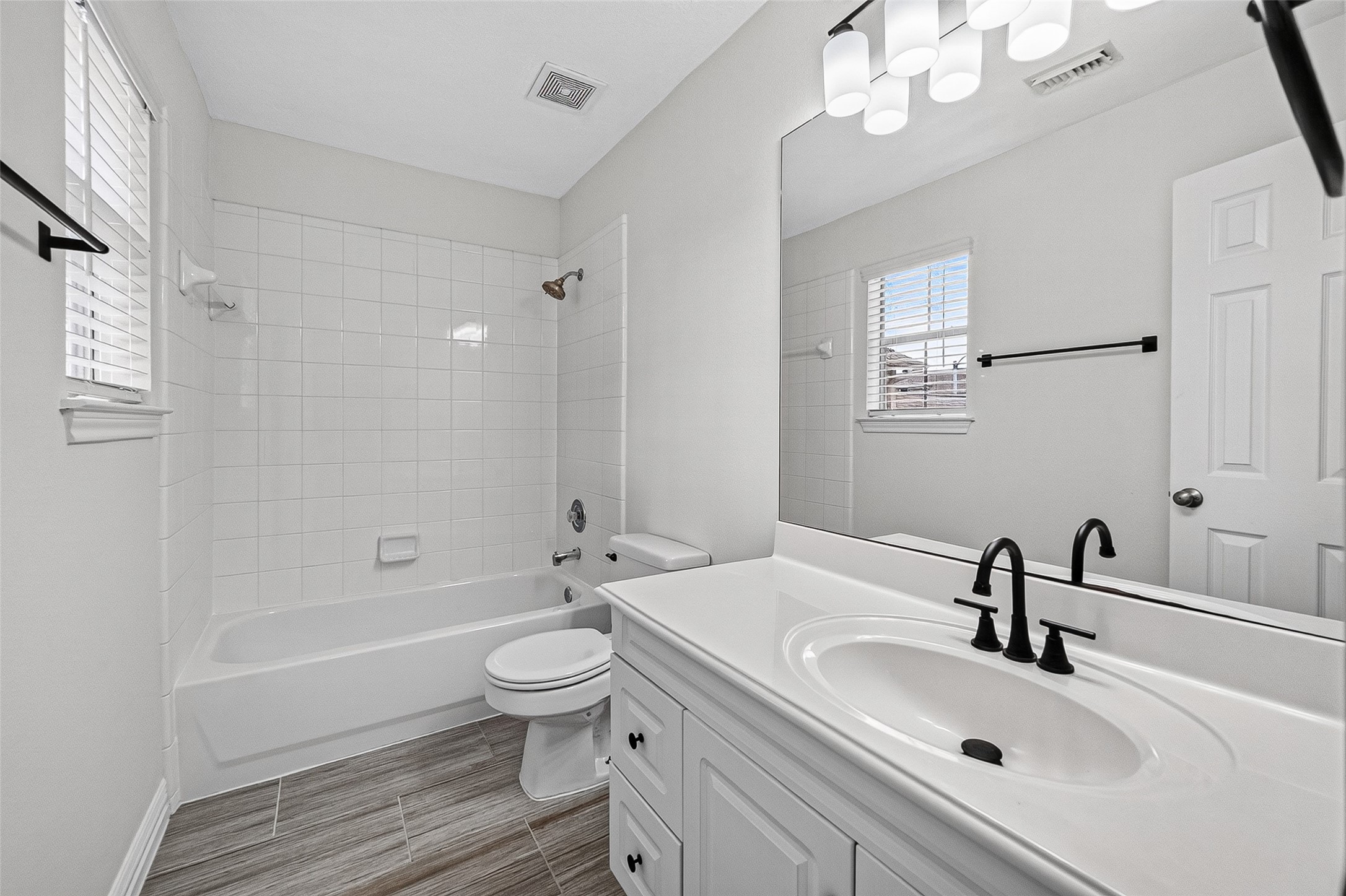 Bathroom with updated vanity and modern black fixtures