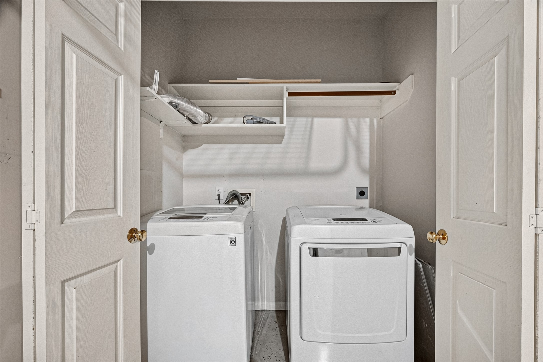 Laundry room with washer and dryer included