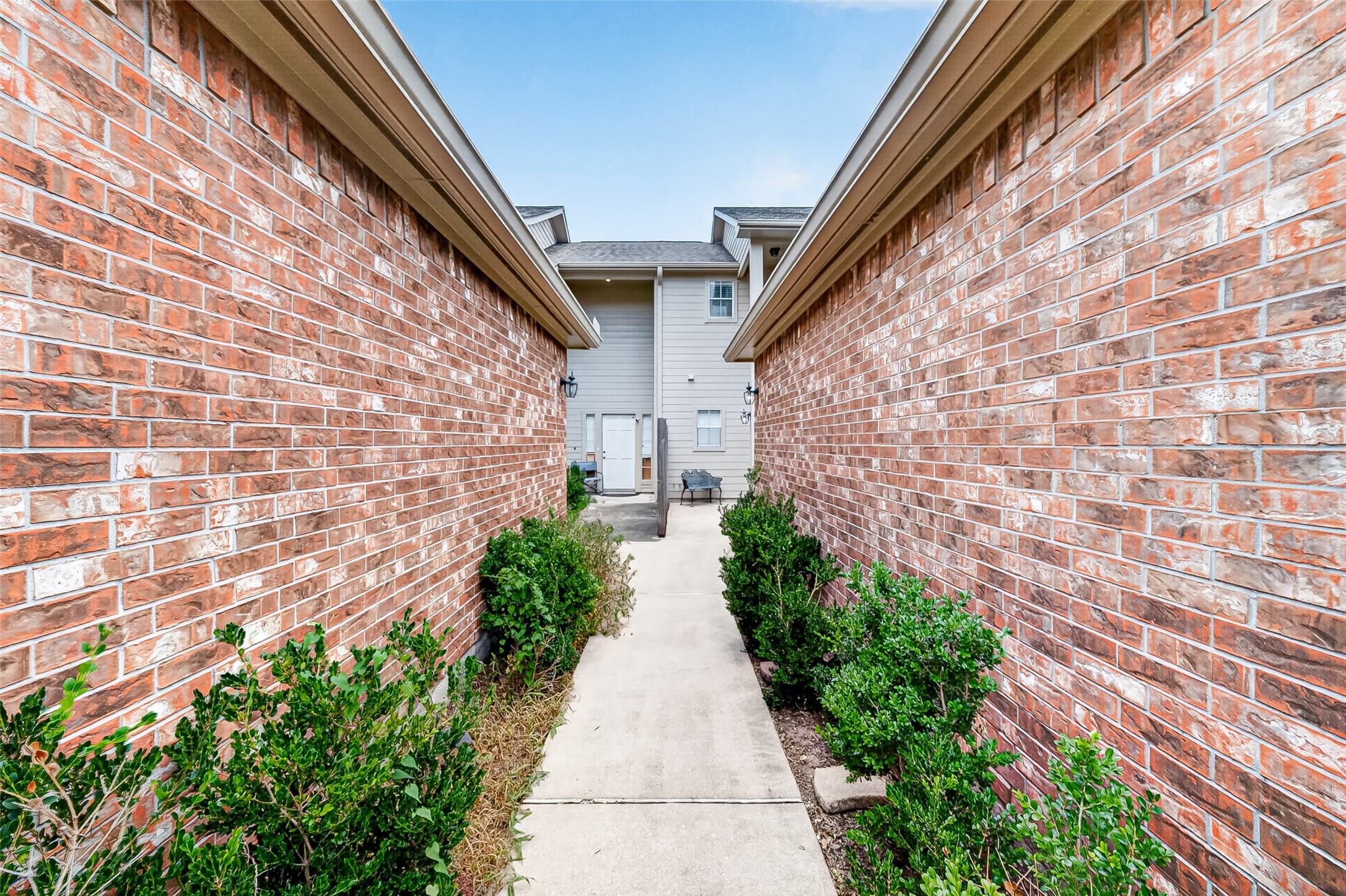 Private, landscaped walkway leads to the front entry