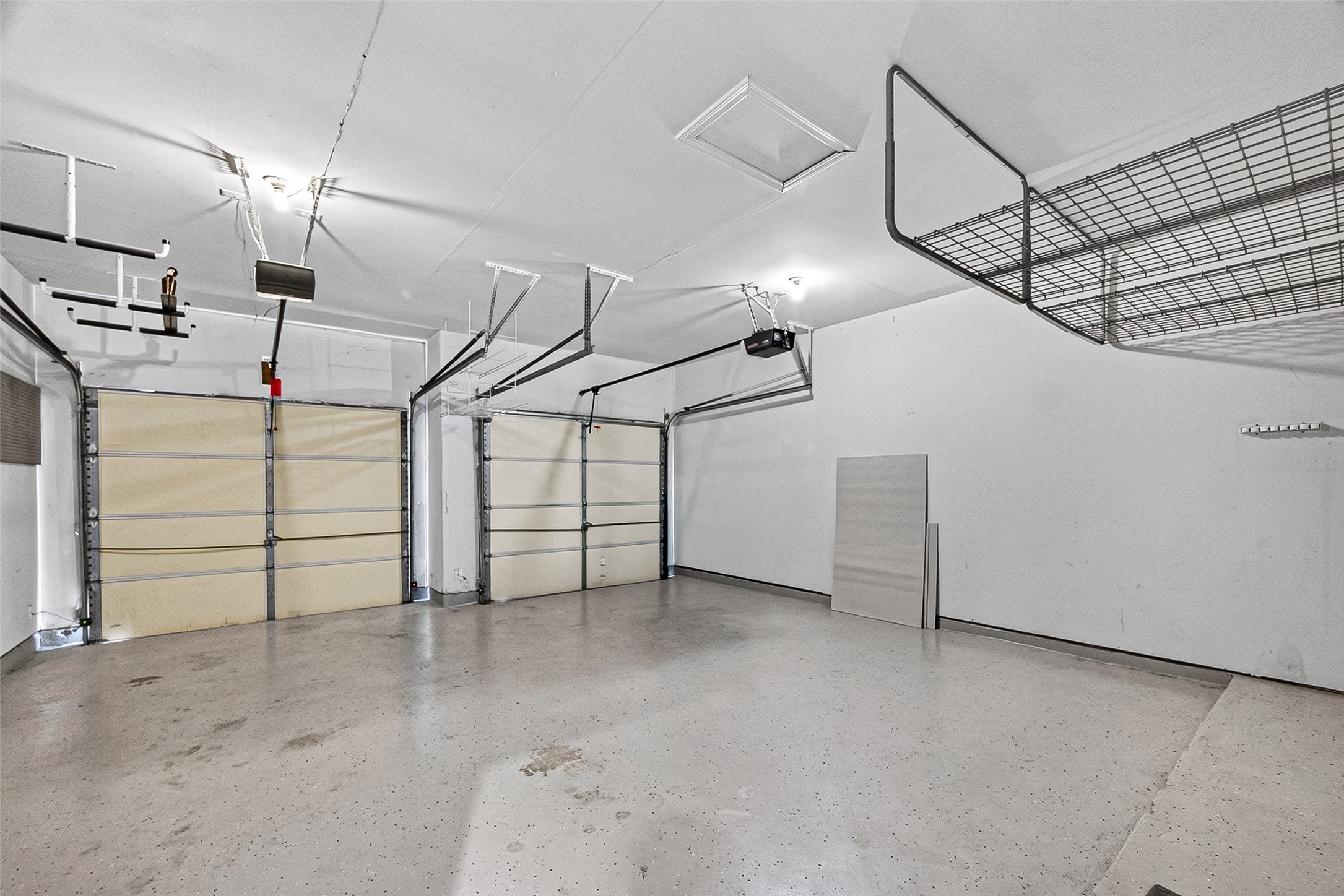 Garage with overhead storage racks for extra space