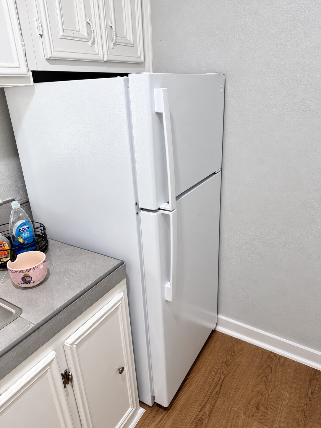 Refrigerator included in the compact kitchen.