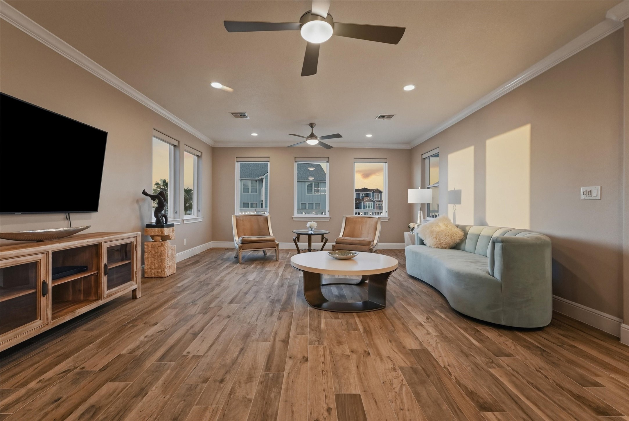 Golden sunset light pours into the main living area, creating a warm, relaxed atmosphere that feels perfectly suited for unwinding at the end of the day.