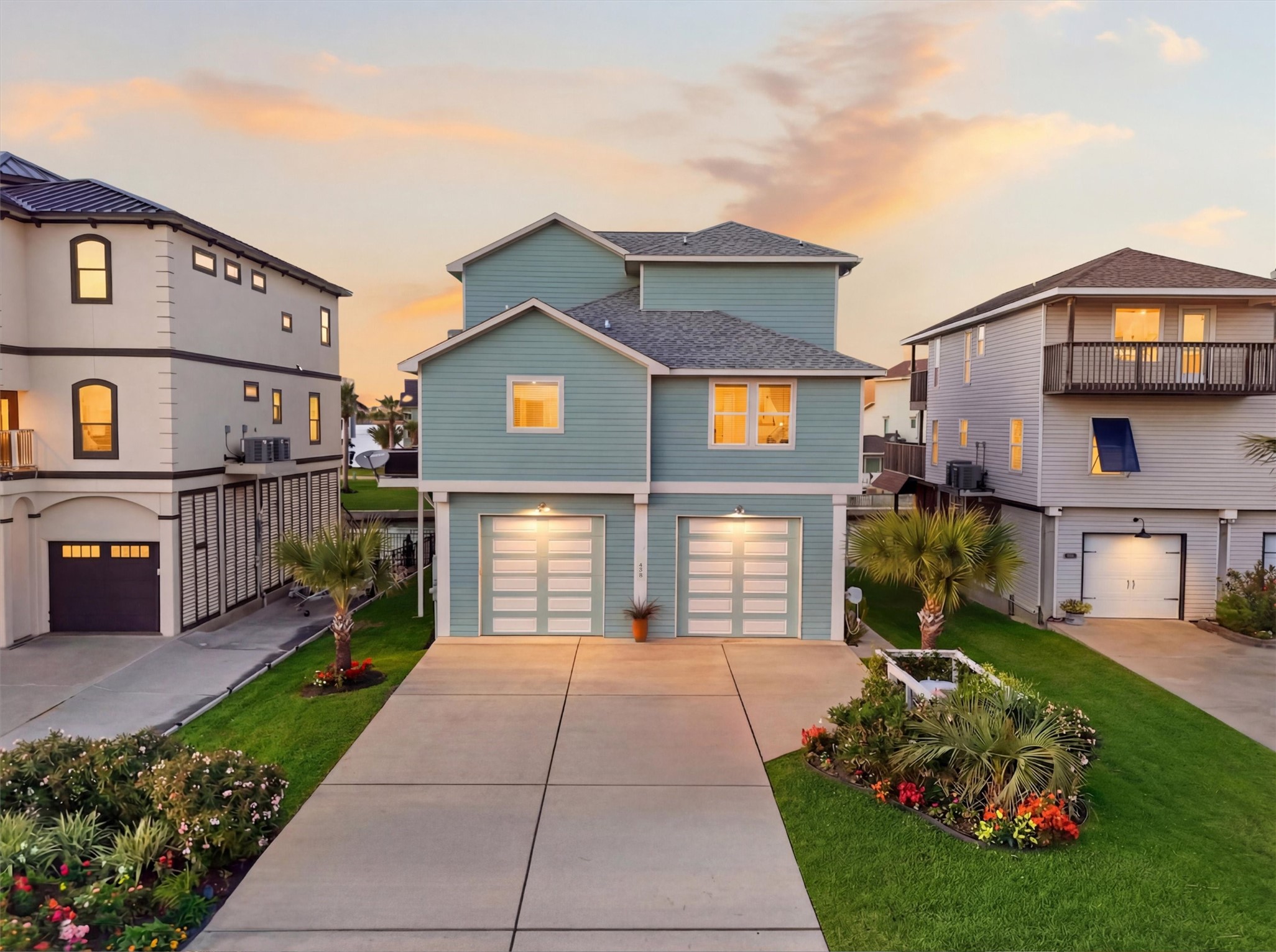 Coastal charm shines from the
curb, where manicured
landscaping, timeless exterior
finishes, and a spacious
driveway create a warm and
polished first impression.