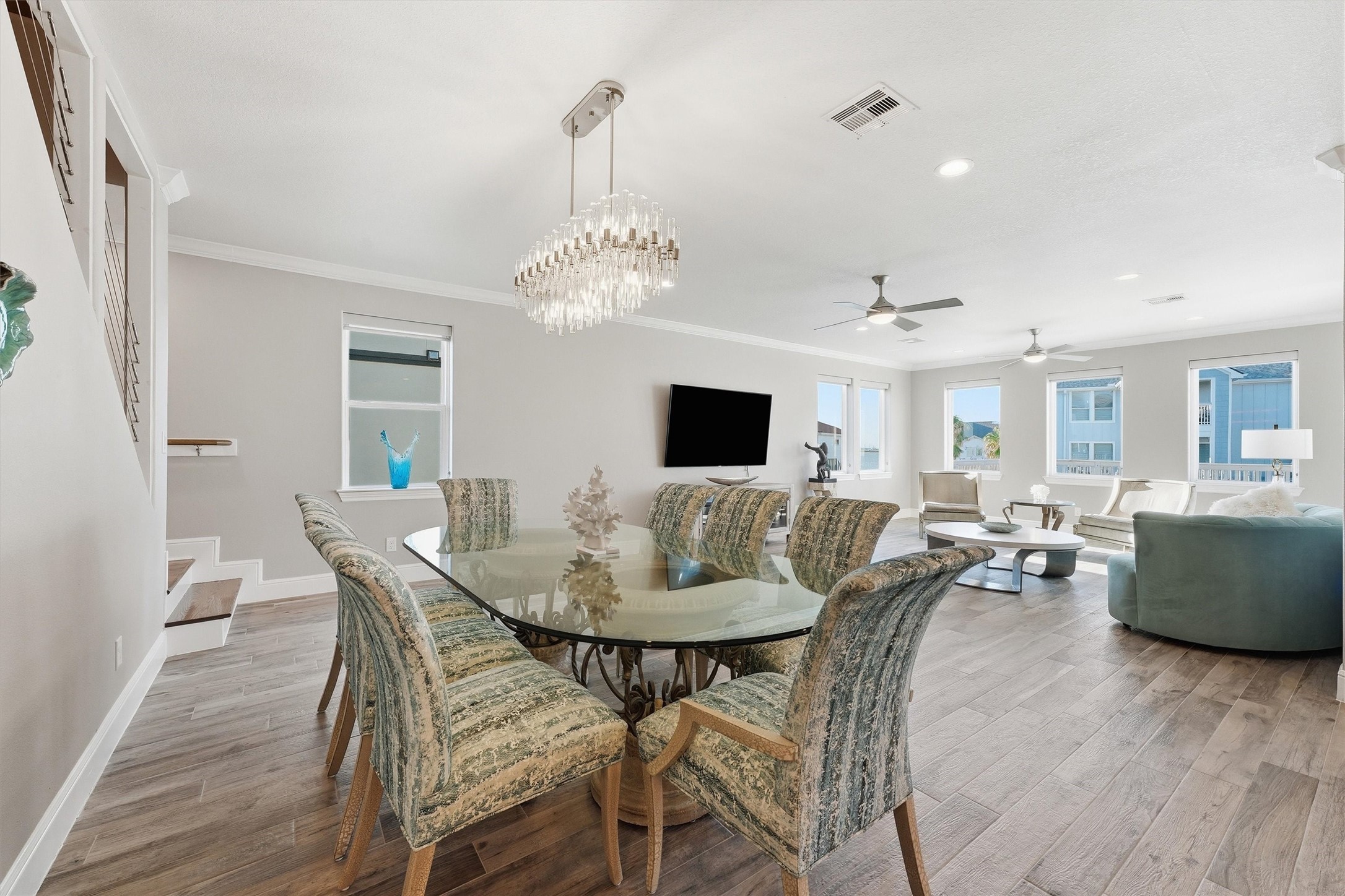 Gather around the table for casual breakfasts, memorable dinners, and easy conversation in this bright dining area that flows seamlessly into the kitchen and living room.