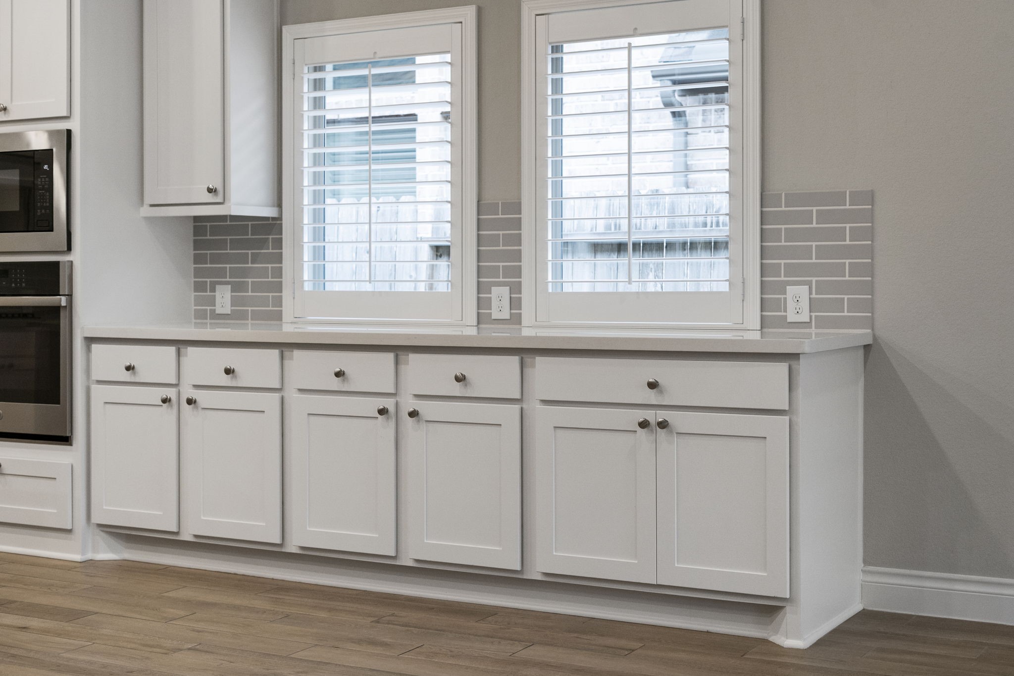 Built-in cabinetry and extra counter space in the dining area make entertaining easy, with plenty of room for serving and buffet-style dining.