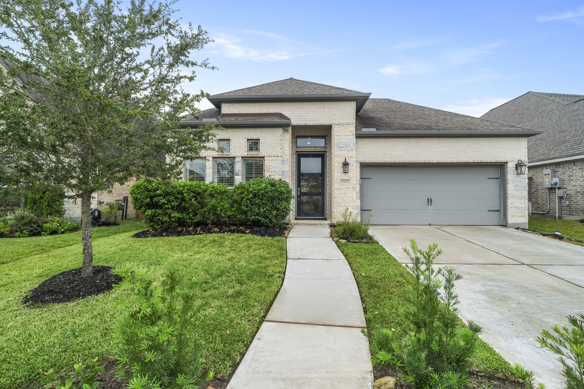 Lovingly cared for by its original owner, this 2020 Perry Homes brick one-story combines modern style with a spacious, inviting feel.