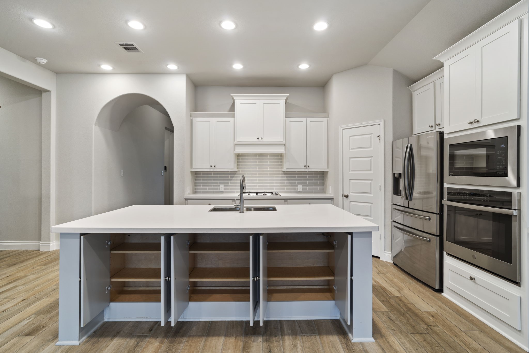 Keep kitchen essentials organized and within easy reach with accessible island storage on both sides.