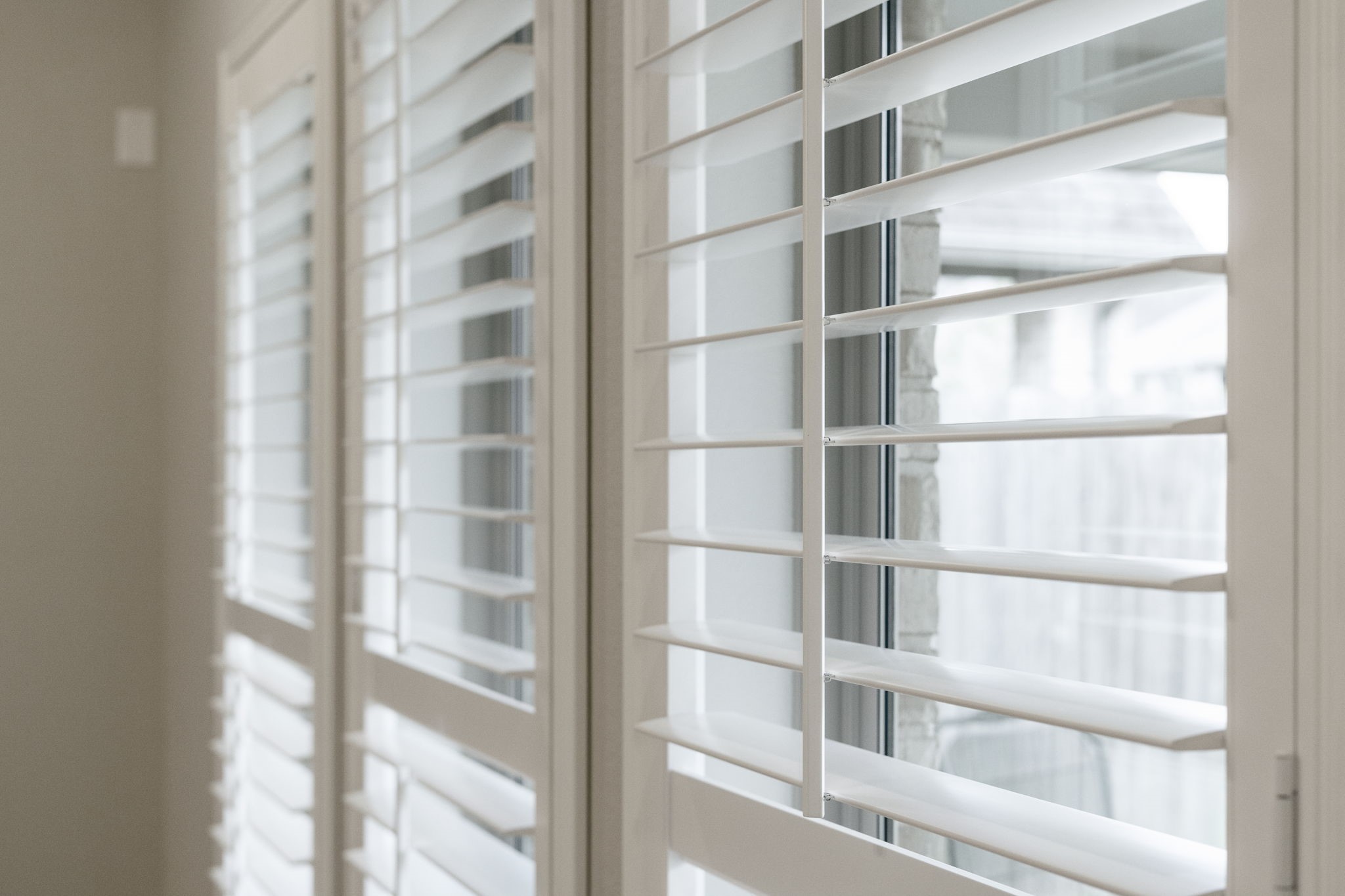 Classic plantation shutters offer privacy while allowing you to control the amount of natural light.