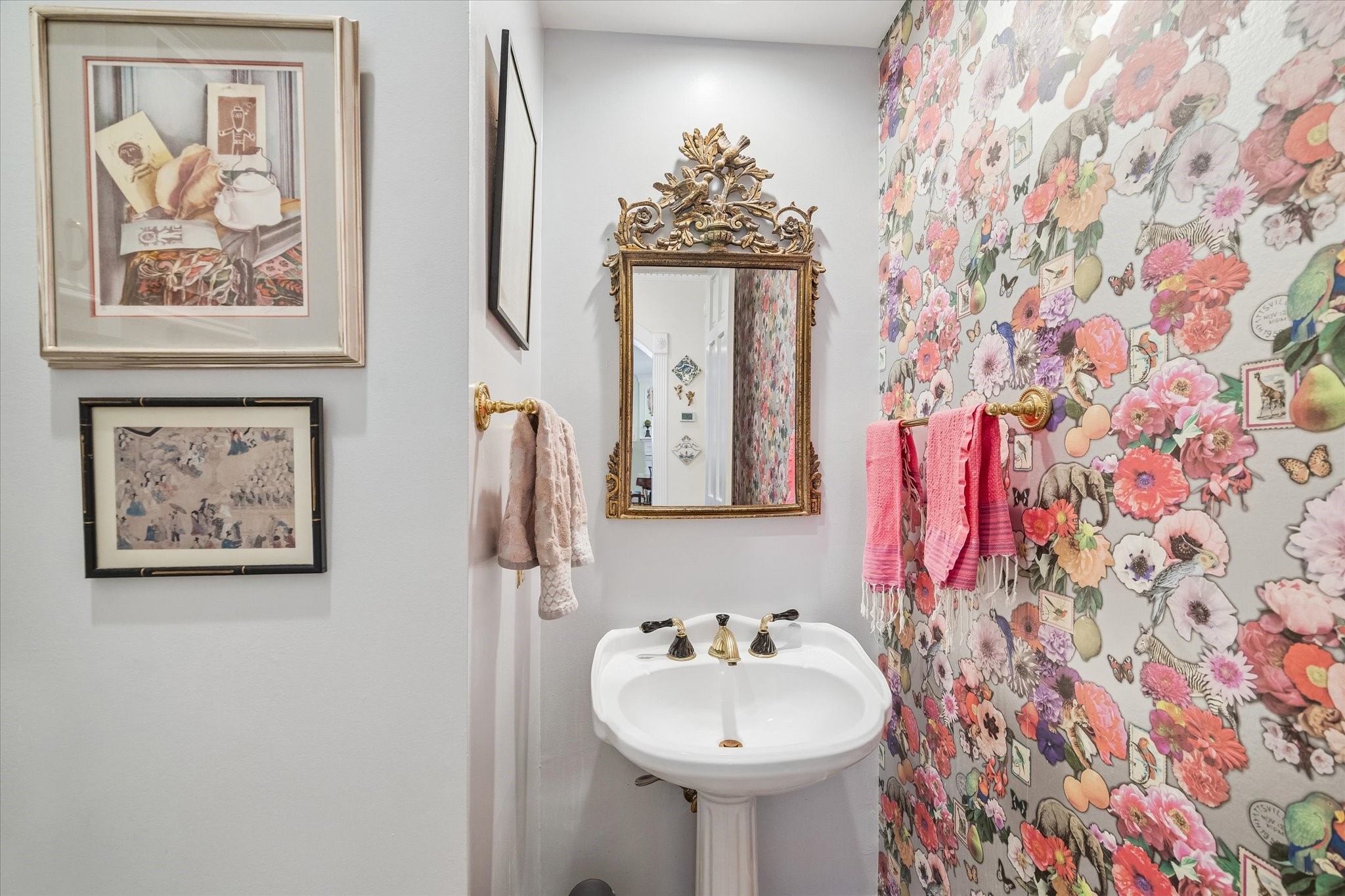 Fabulous half bath with accent wallpaper!
