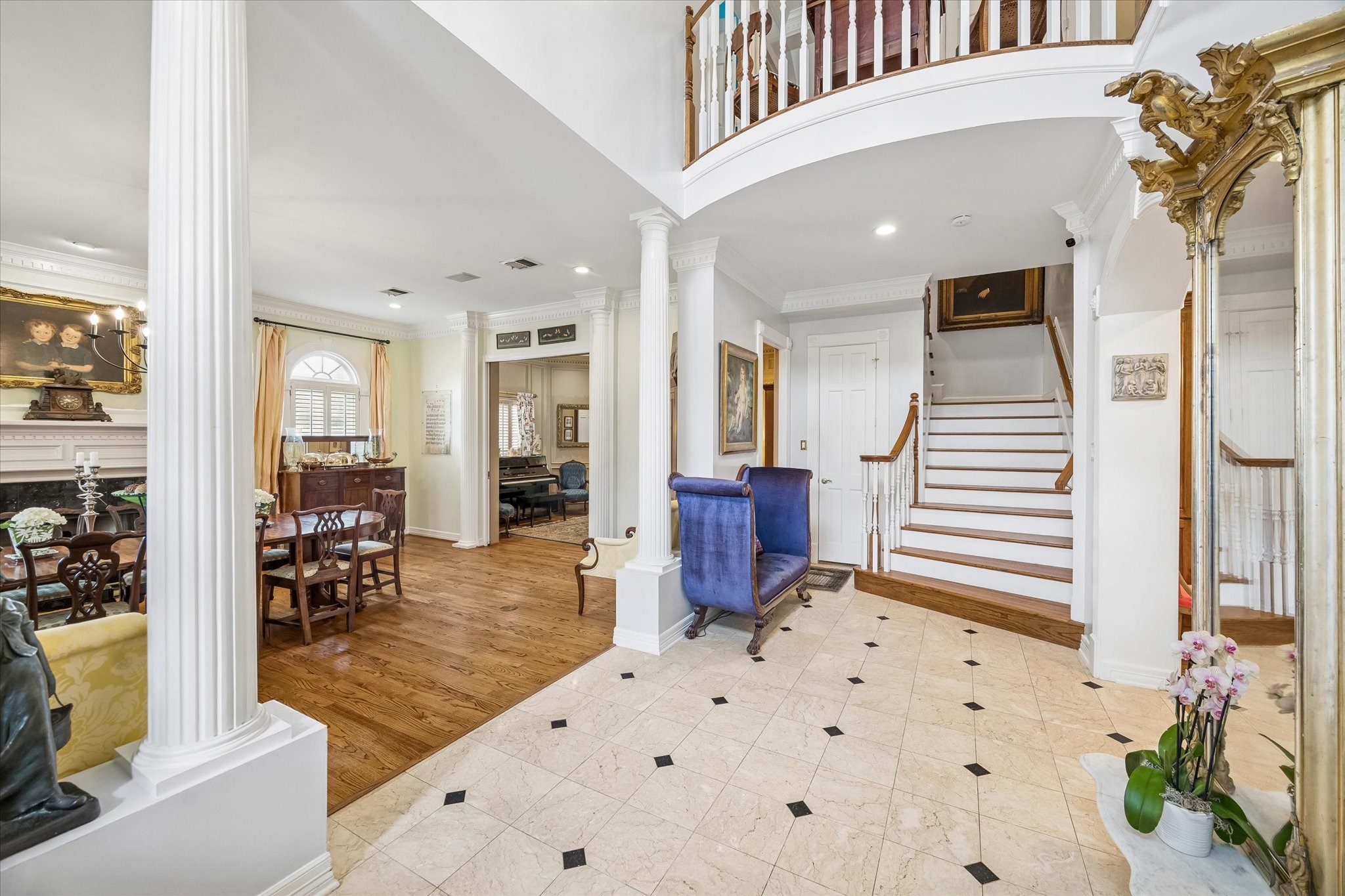 A sweeping foyer greets you as you step inside. Marble floors, elegant columns and gorgeous formals set the tone for the rest of the home. Underneath the stairs is a huge storage closet.