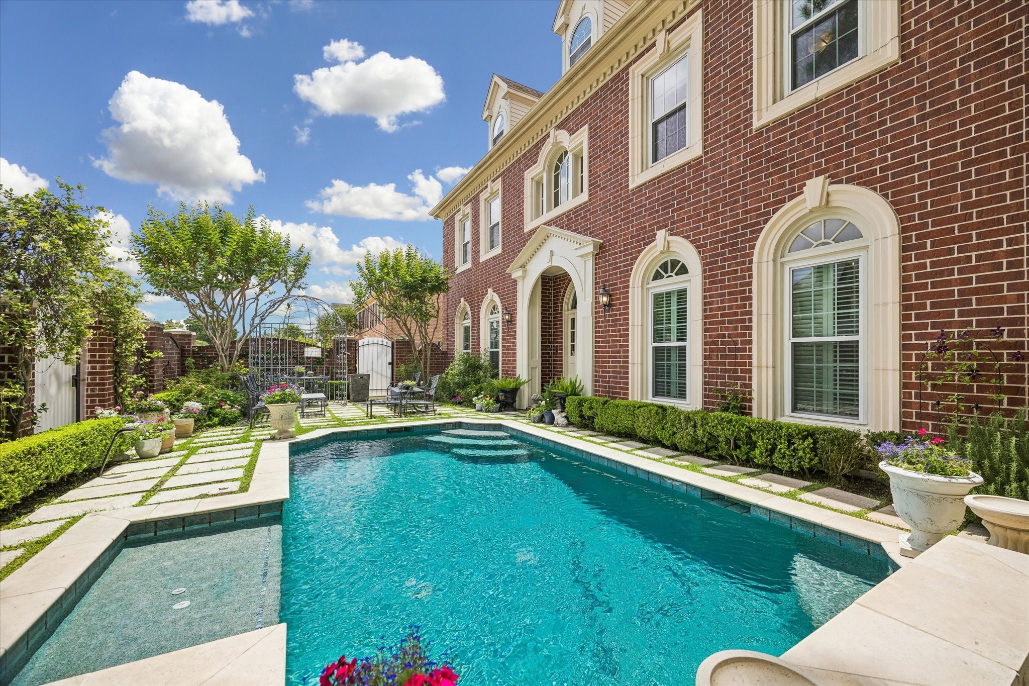 Absolutely gorgeous! The pool also features a bubbler shelf and seating below the fountain.