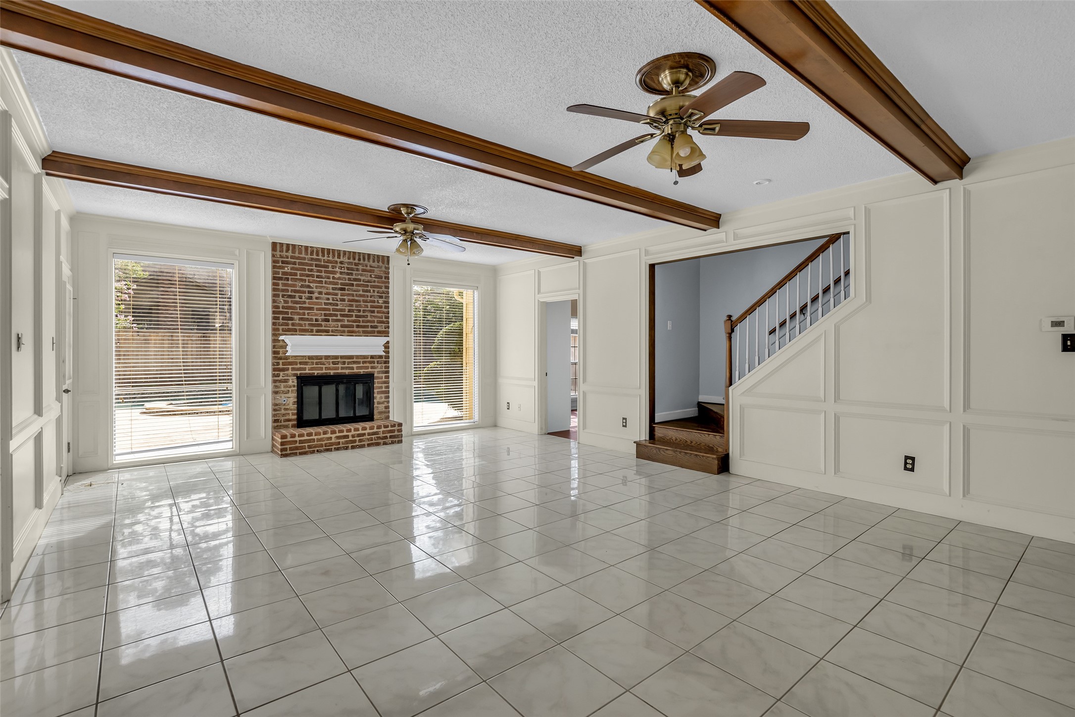 As you step past the foyer, you'll be greeted by a view of the inviting family room.