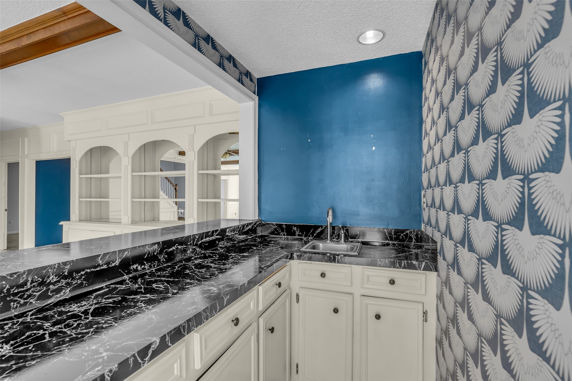 Just off the family room, the wet bar provides a convenient space for serving drinks and entertaining guests.