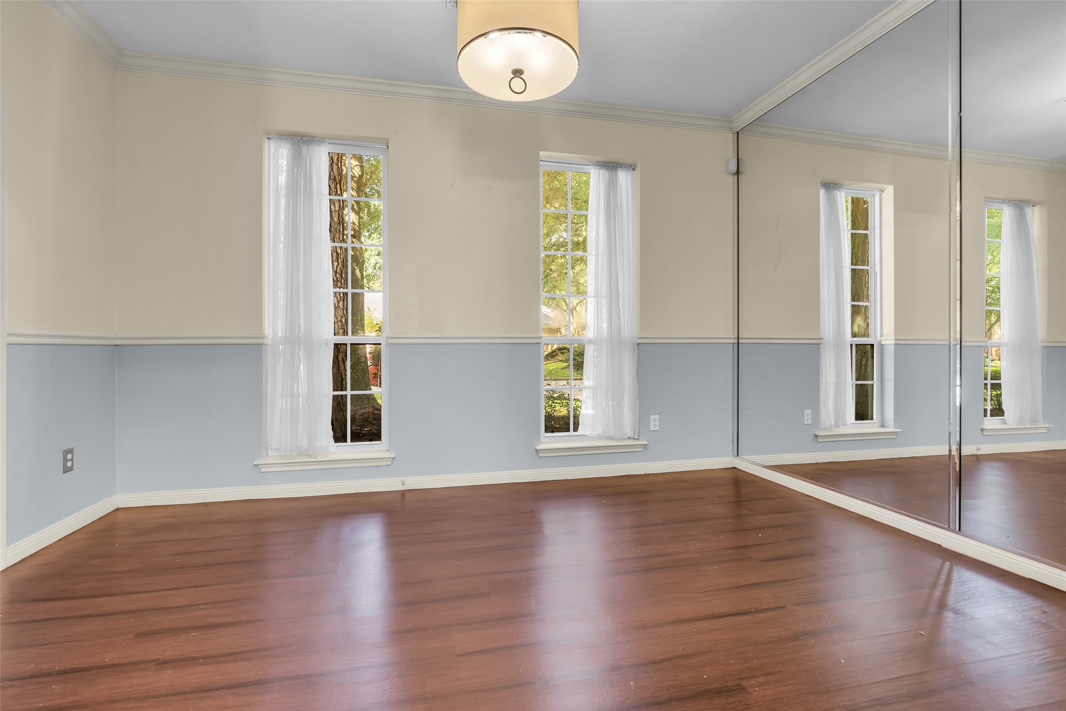 The formal dining area faces the front of the home, and its front-facing windows bring in plenty of natural light, creating a bright and inviting setting for meals and gatherings.