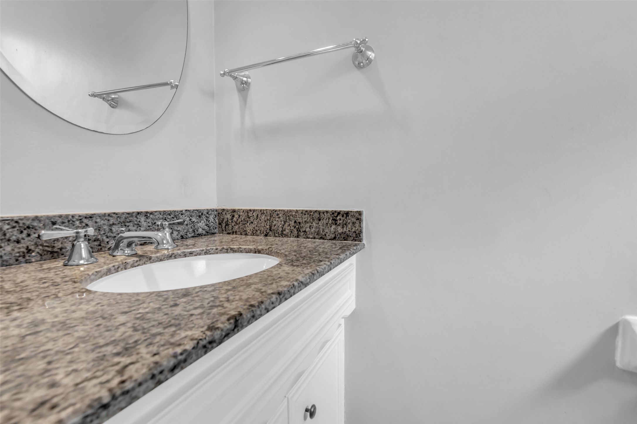 The first-floor half bath is conveniently located for everyday use and features modern fixtures.