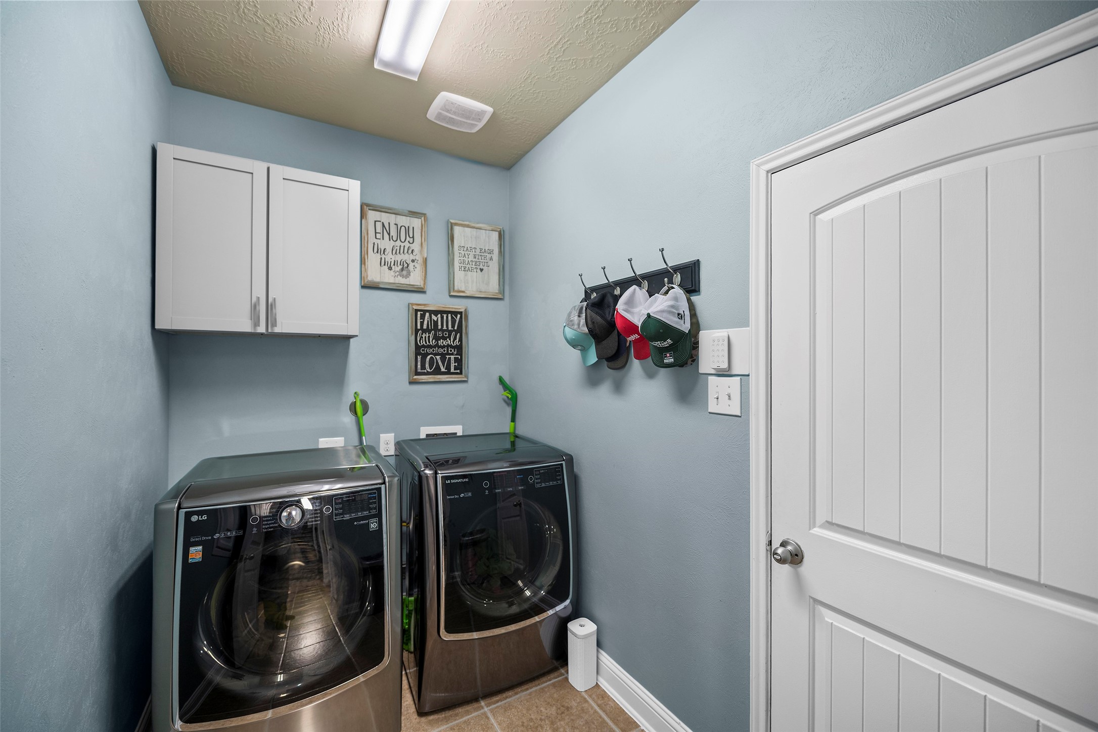The laundry room is located in-home. Please note that the washer an dryer are excluded form the sale.