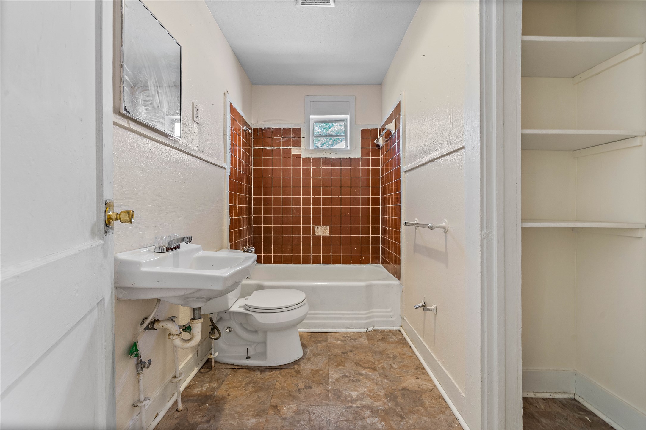 Large bathroom with a separate linen closet. Large bathroom with a separate linen closet.