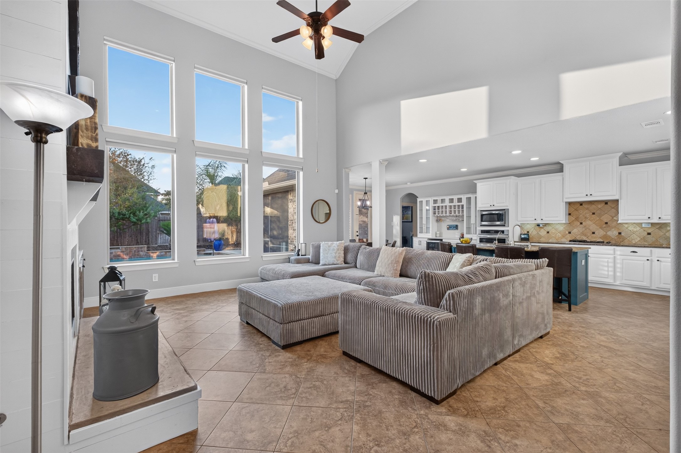 The open plan concept shows just how large this living room is. Natural light and views of the pool make this a fabulous entyertaining space