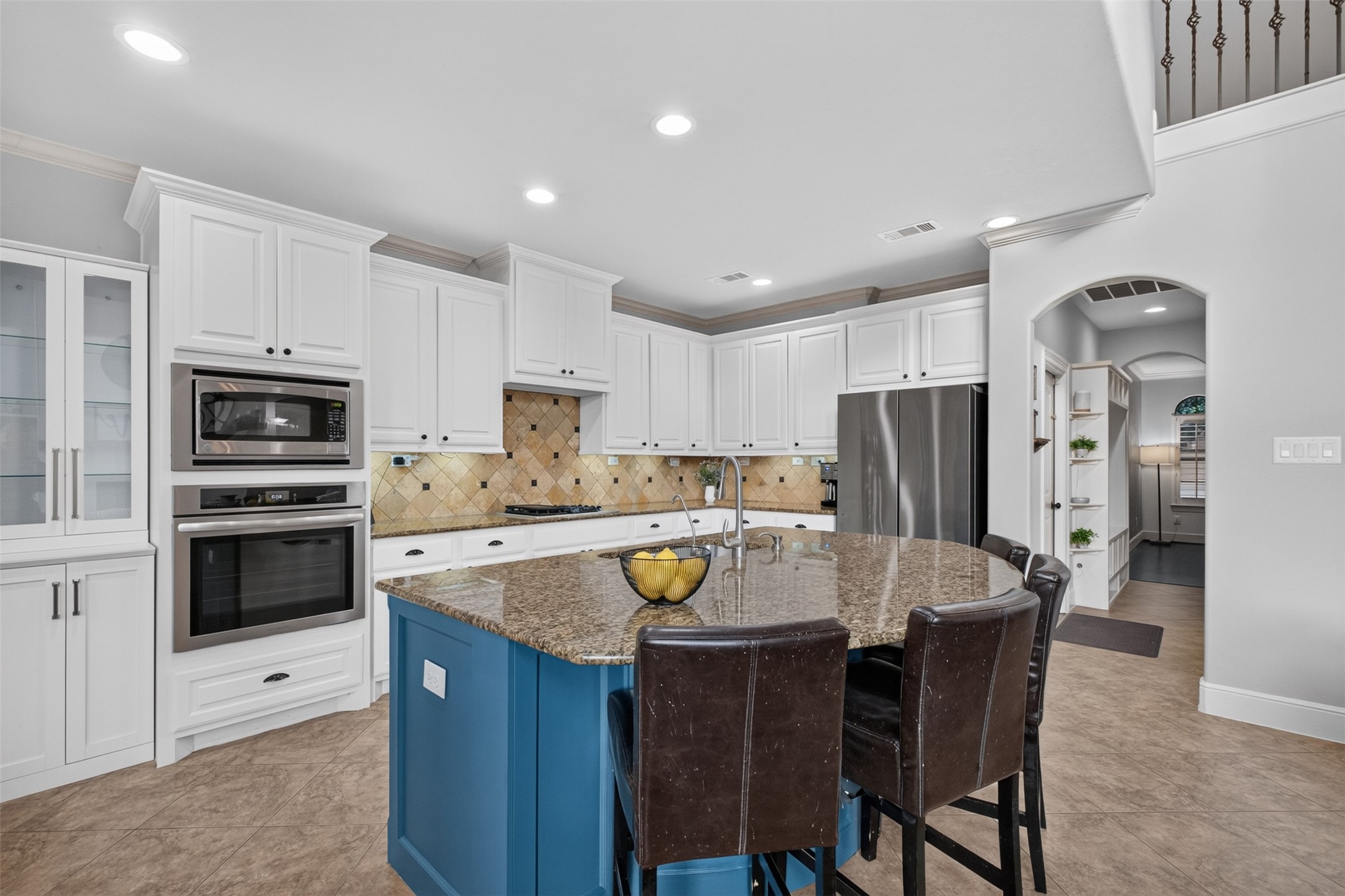 The kitchen has upgraded appliances and a large island for prep space and seating. The kitchen has upgraded appliances and a large island for prep space and seating.