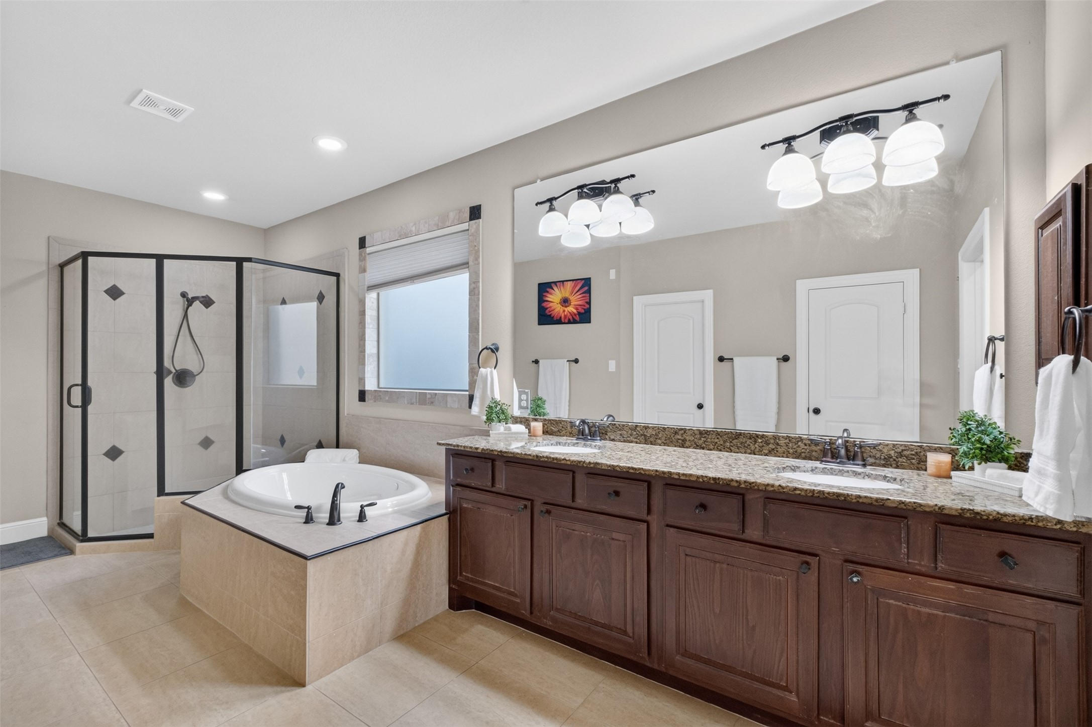 Double sinks, granite work tops, soaking bath and large separate shower in the primary ensuite