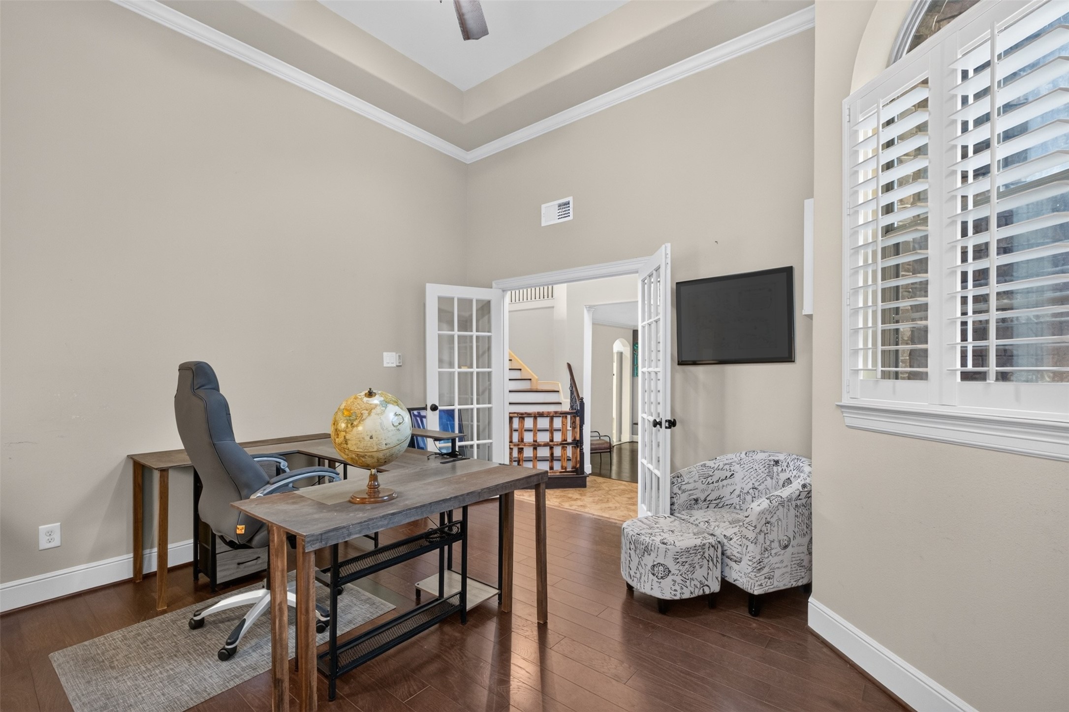 Another view of the office - showing the plantation shutters and tray ceiling