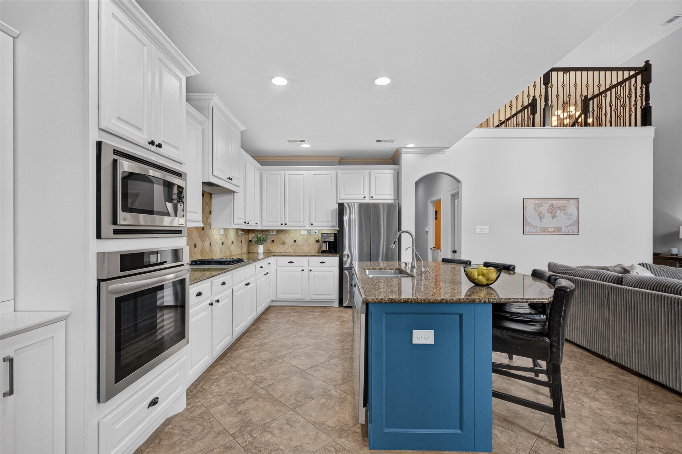 Large chefs kitchen with plenty of prep space and storage. Upgraded stainless steel appliances