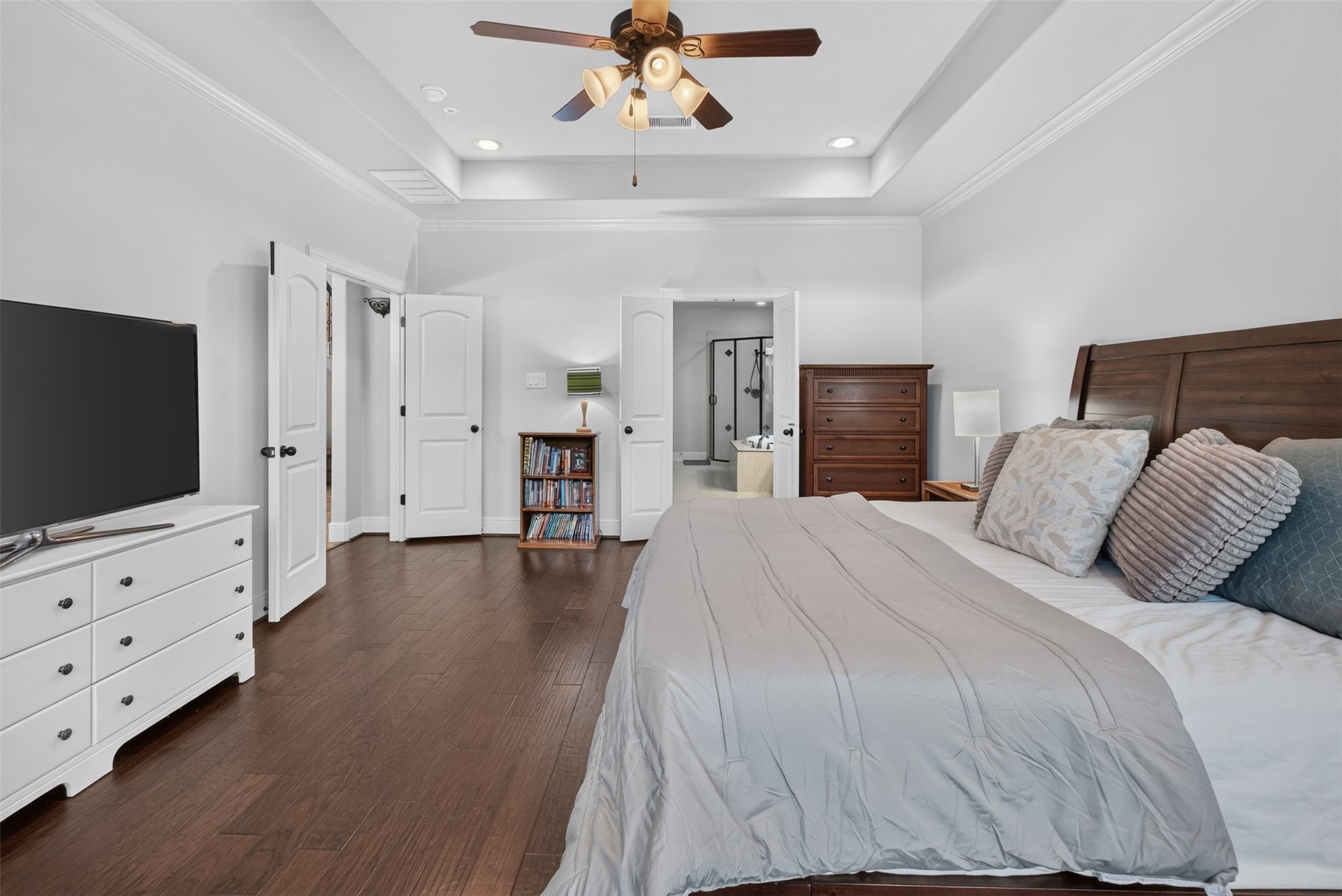 Double doors open on to the primary bedroom and leads through to the primary ensuite