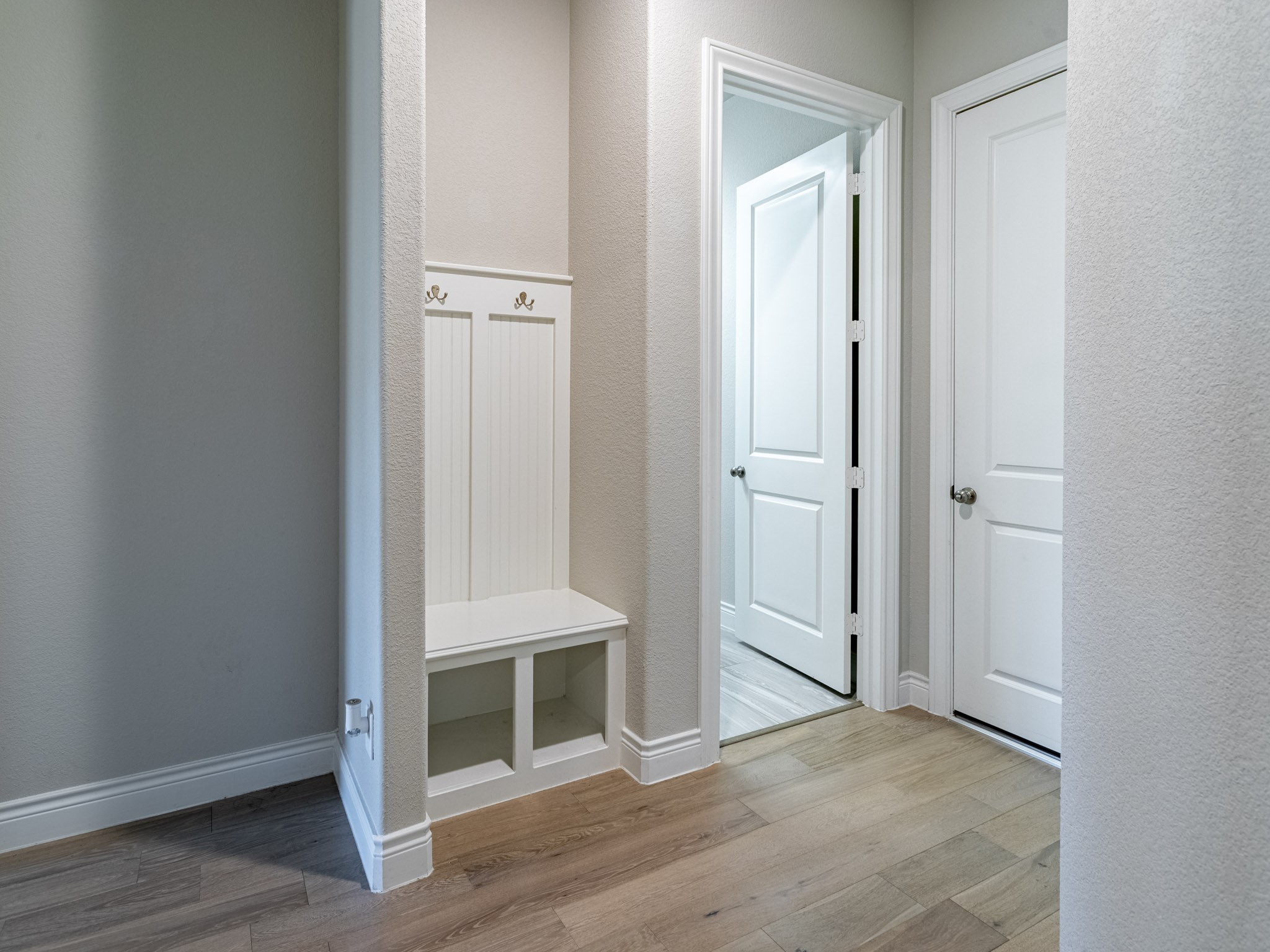 Mud room at entry from two car garage.