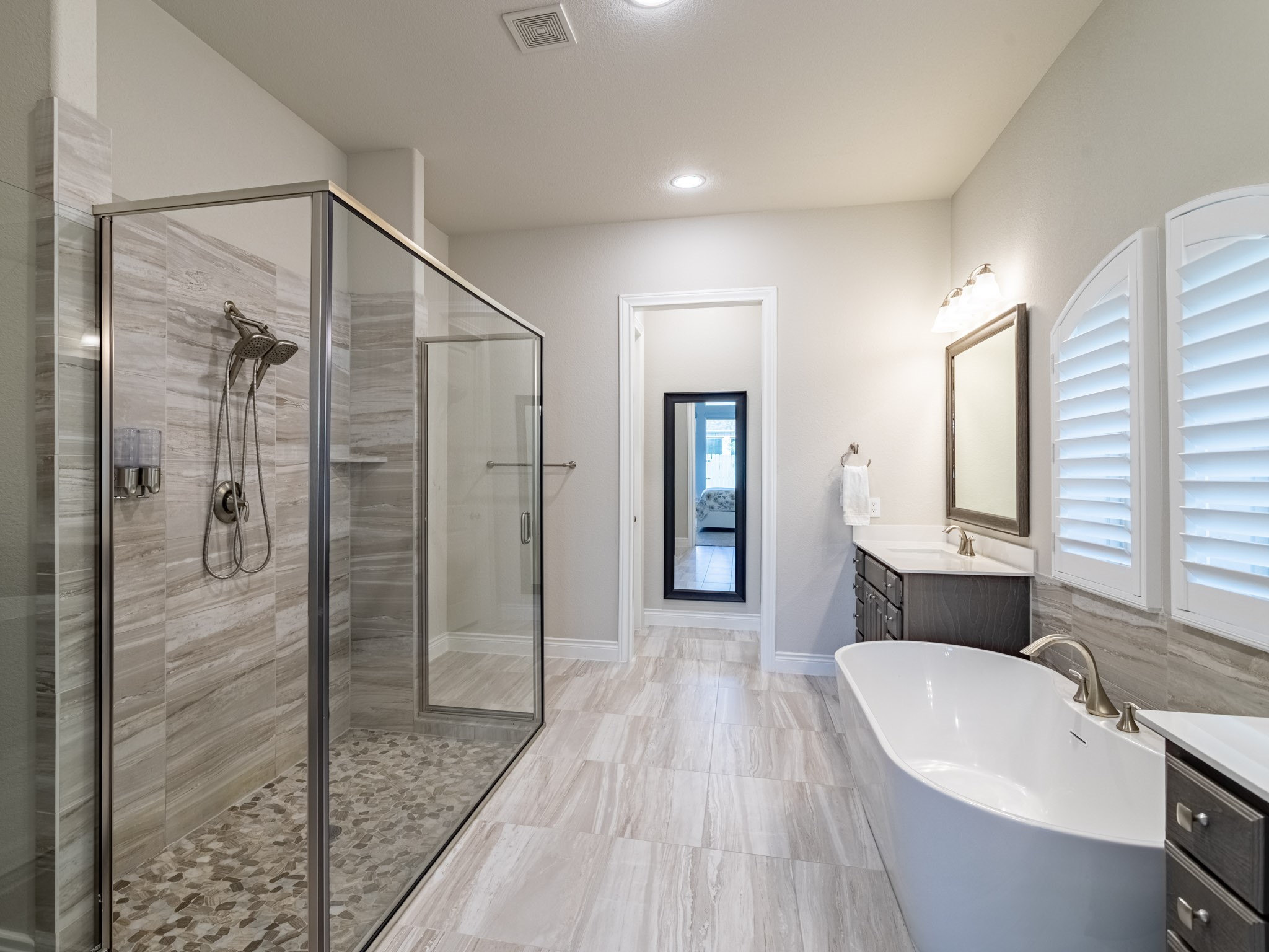 Primary bath with soaking tub and extended shower