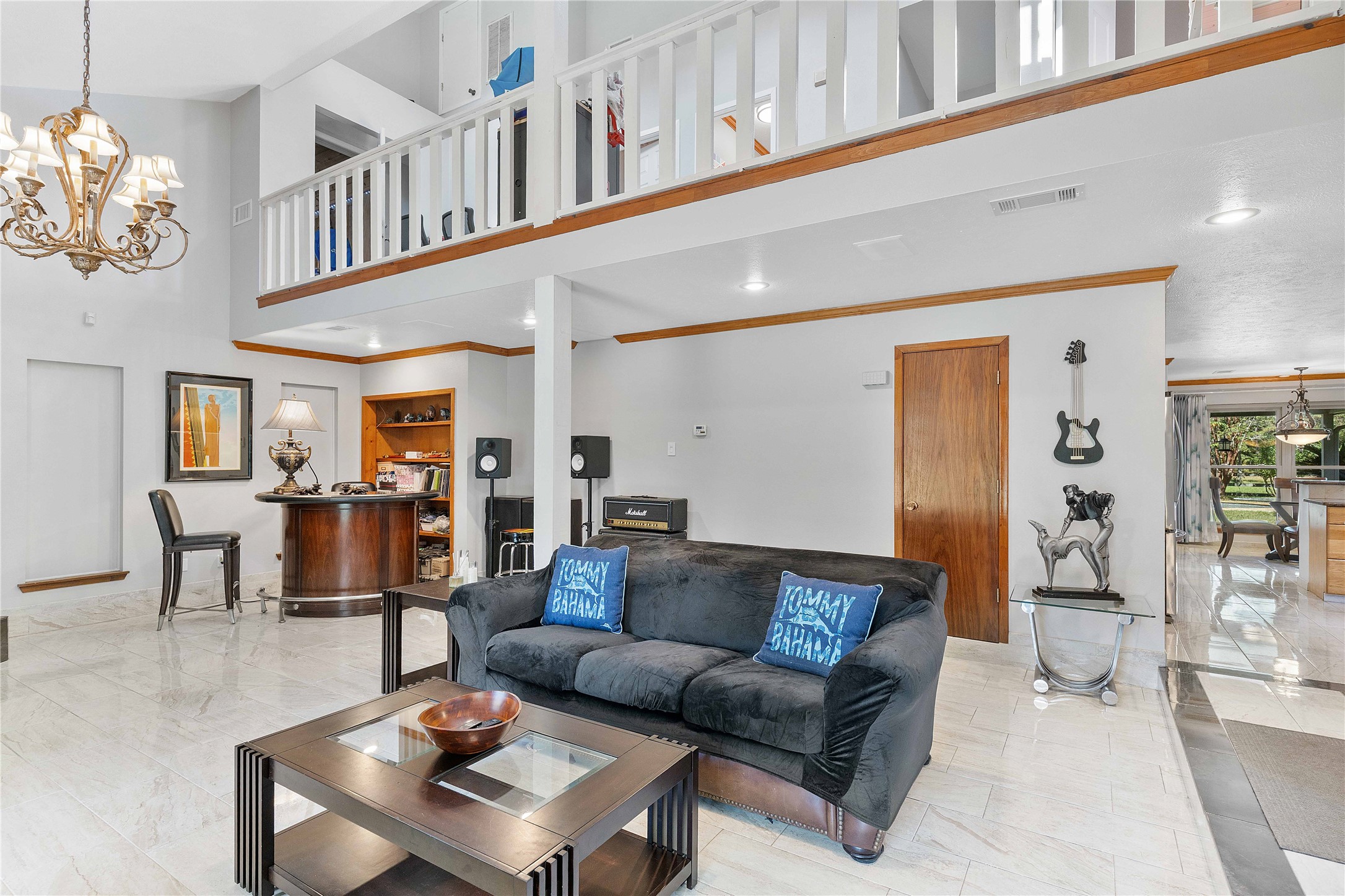 Another view of the front living area.  Upstair hallway looks down to the living room