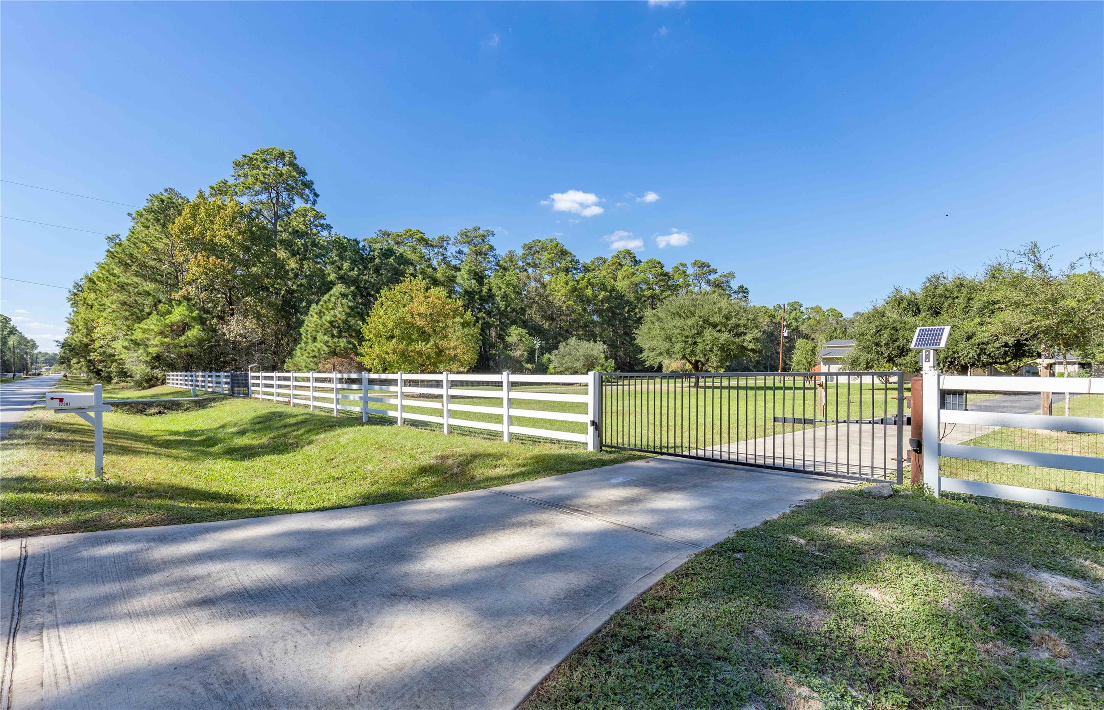 Welcome to 17381 Village way with 2 separate driveways with electric gate openers.