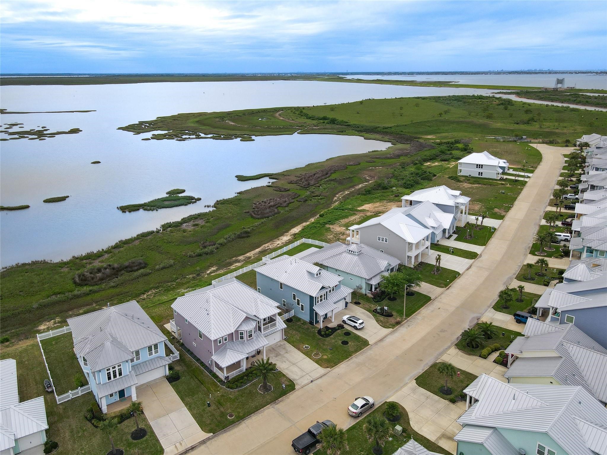 This charming waterfront community with modern homes offer stunning views of the expansive bay and serene natural surroundings.