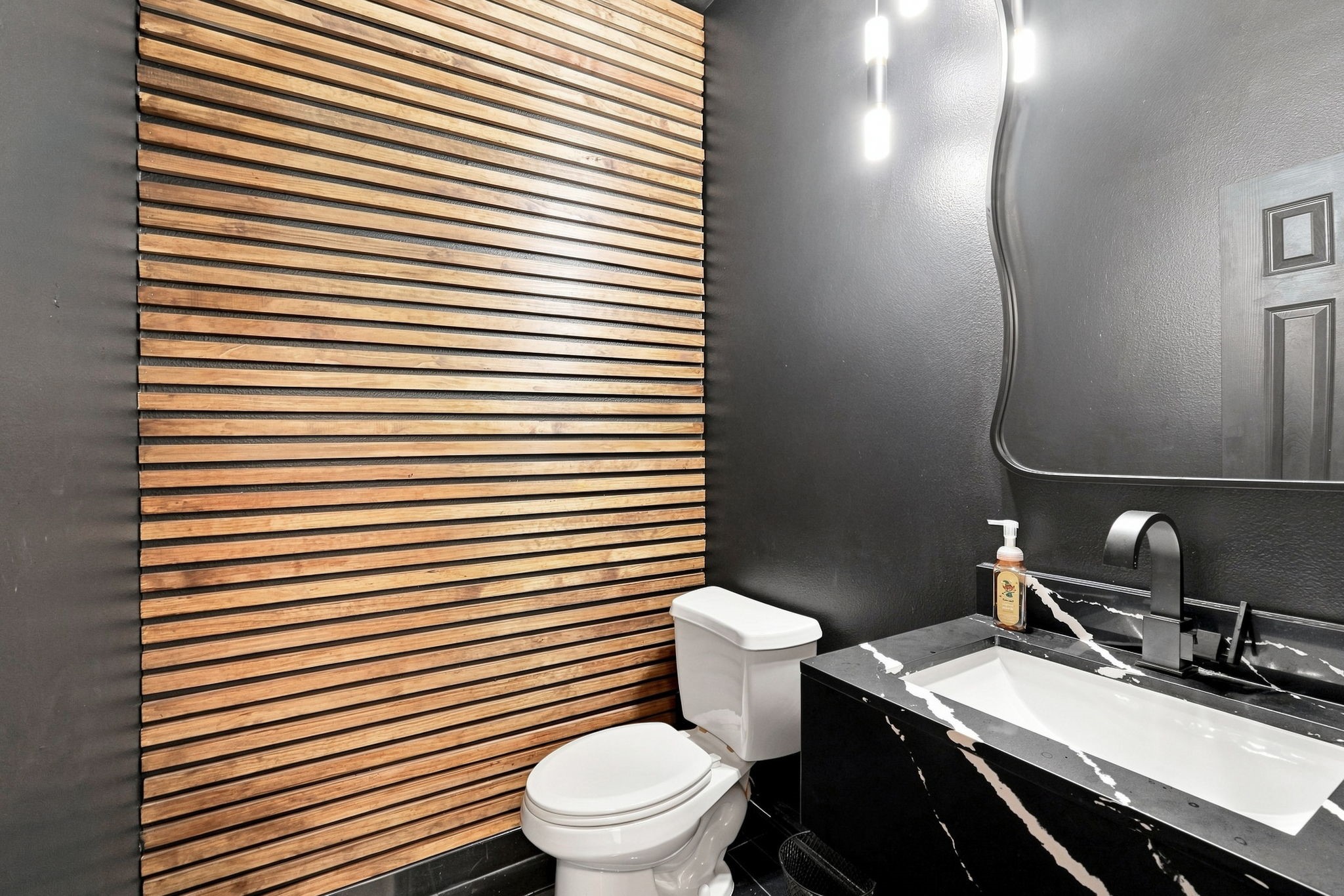 Downstairs half bath just off family room, updated