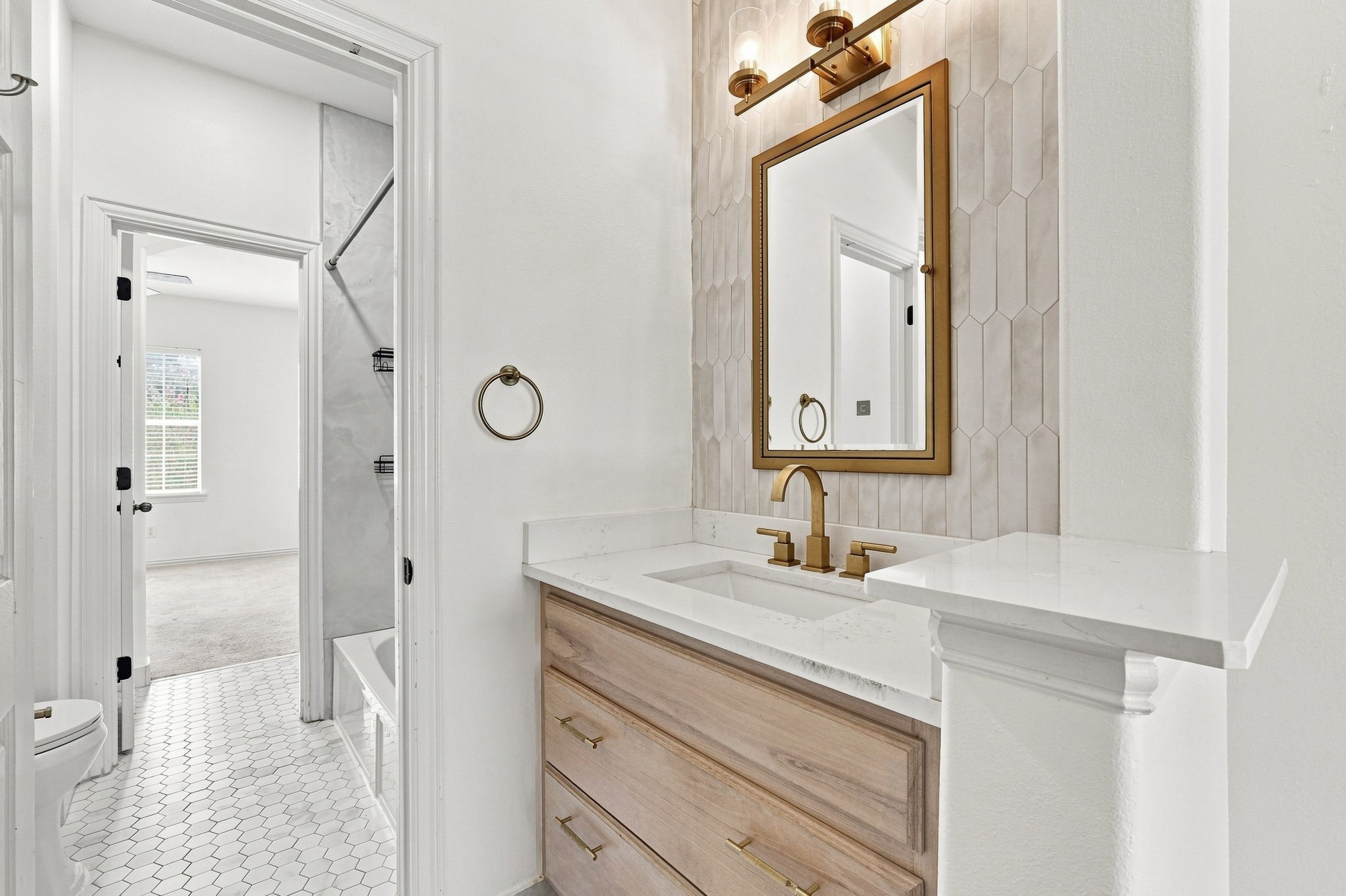 Updated Jack and Jill bathroom connecting secondary bedroom #2 and #3