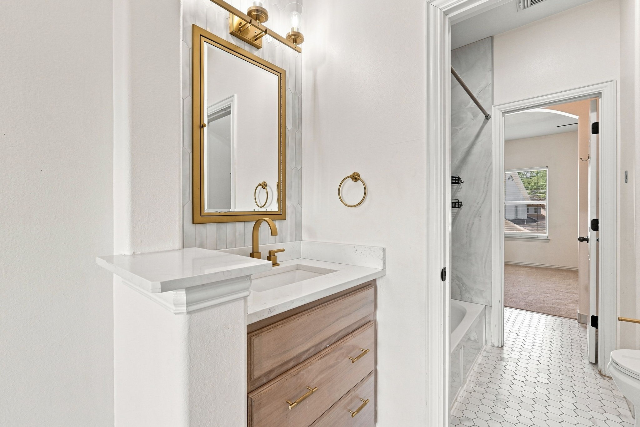 Updated Jack and Jill bathroom connecting secondary bedroom #2 and #3