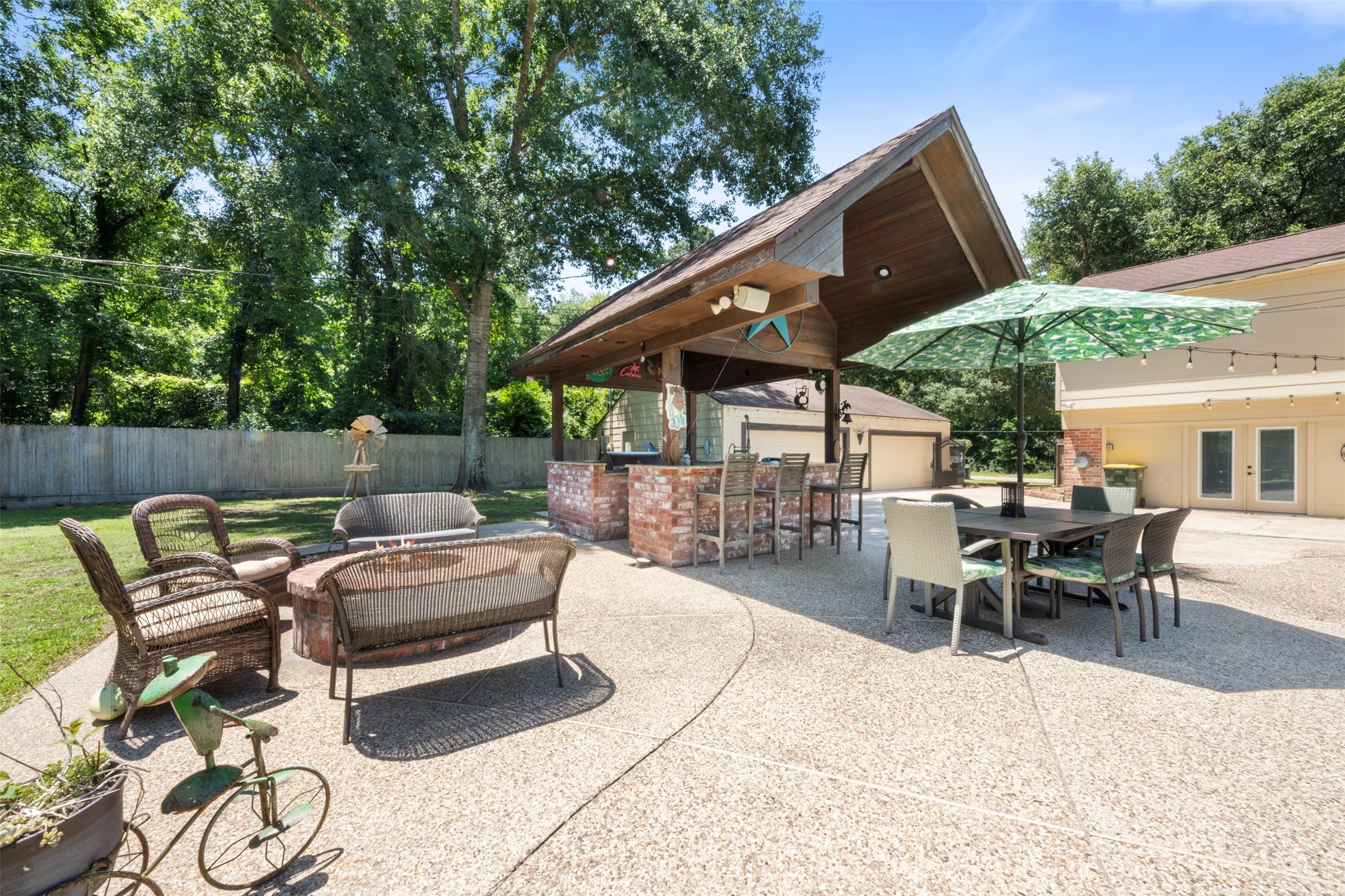 Outside patio -- gazebo, fire-pit, pool, and outdoor kitchen.