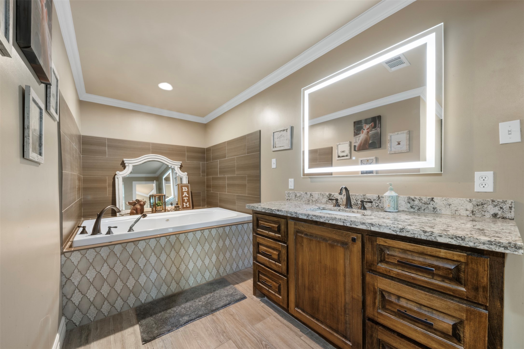 Primary full bathroom "Hers" featuring dimmable vanity mirror, and luxury soaking tub